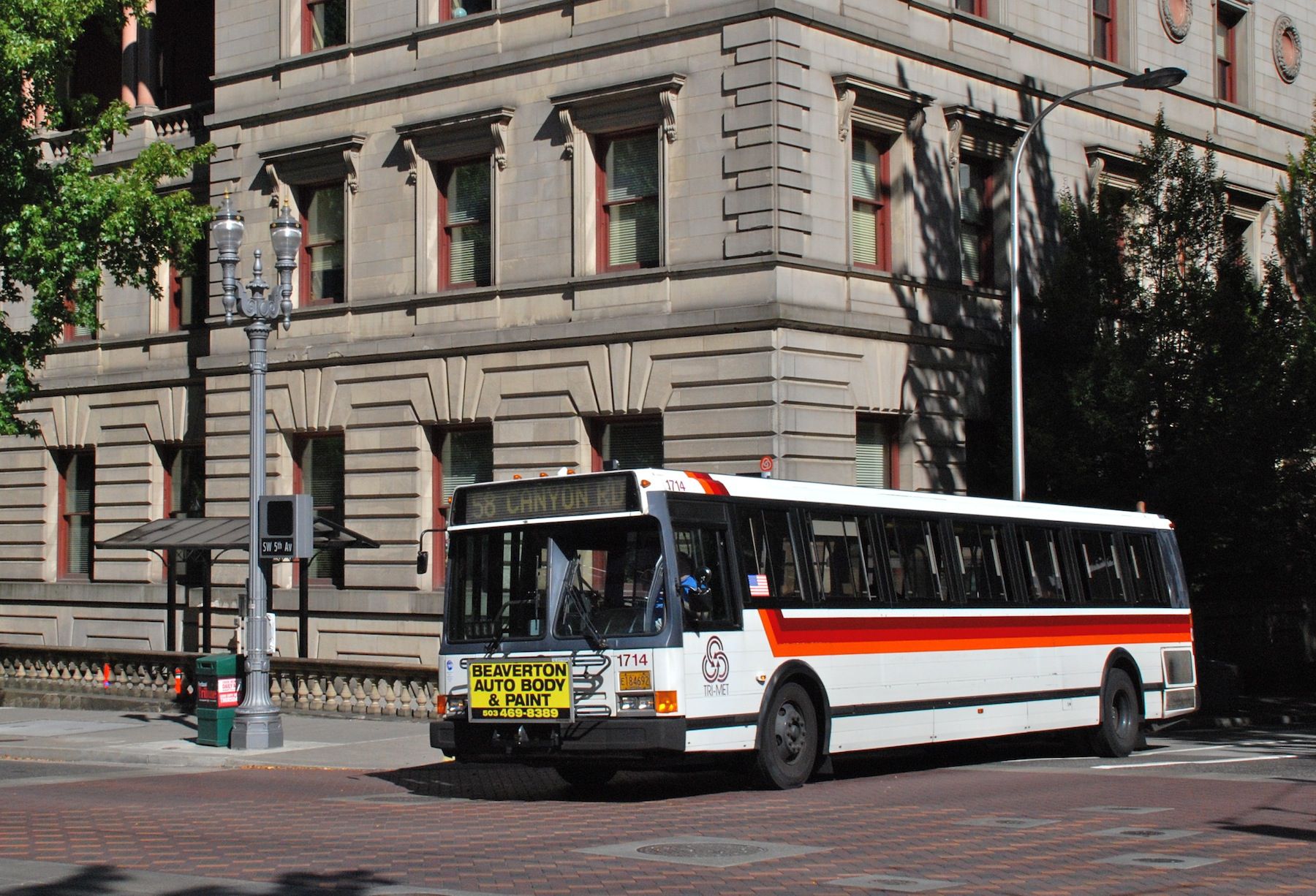 Bus 1714 of TriMet, a 1992 Flxible Metro bus, on Jefferson Street at 5th Avenue, in downtown Portland.