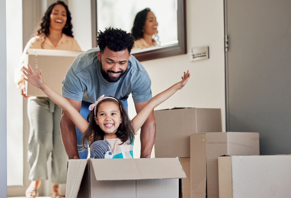 Shot of a young father having fun with his daughter at home