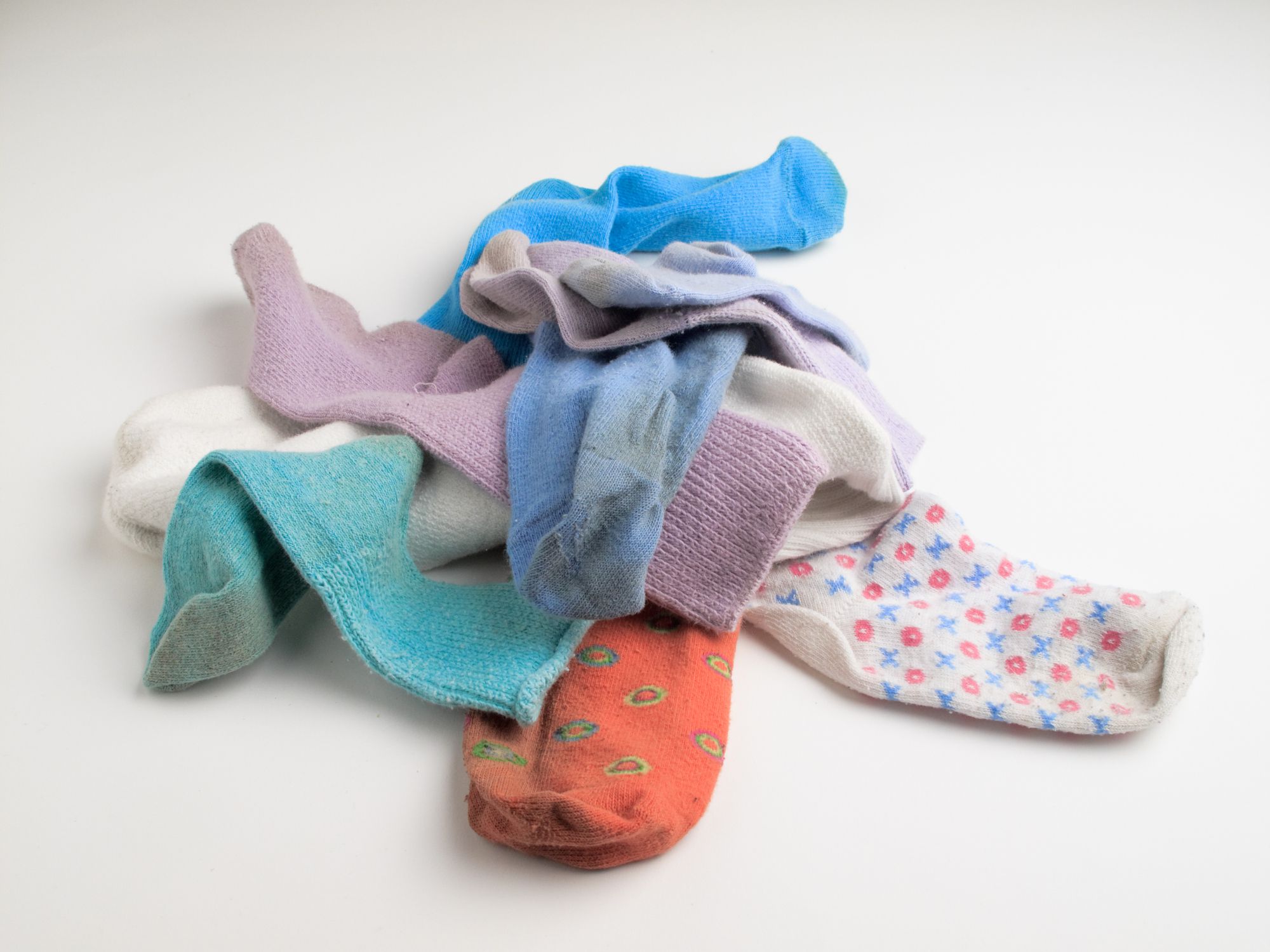 A pile of old socks without matches.