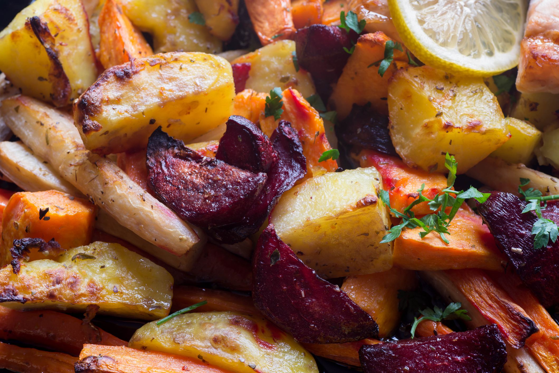 baked vegegetables roots macro: carrot, potato, beet, parsley