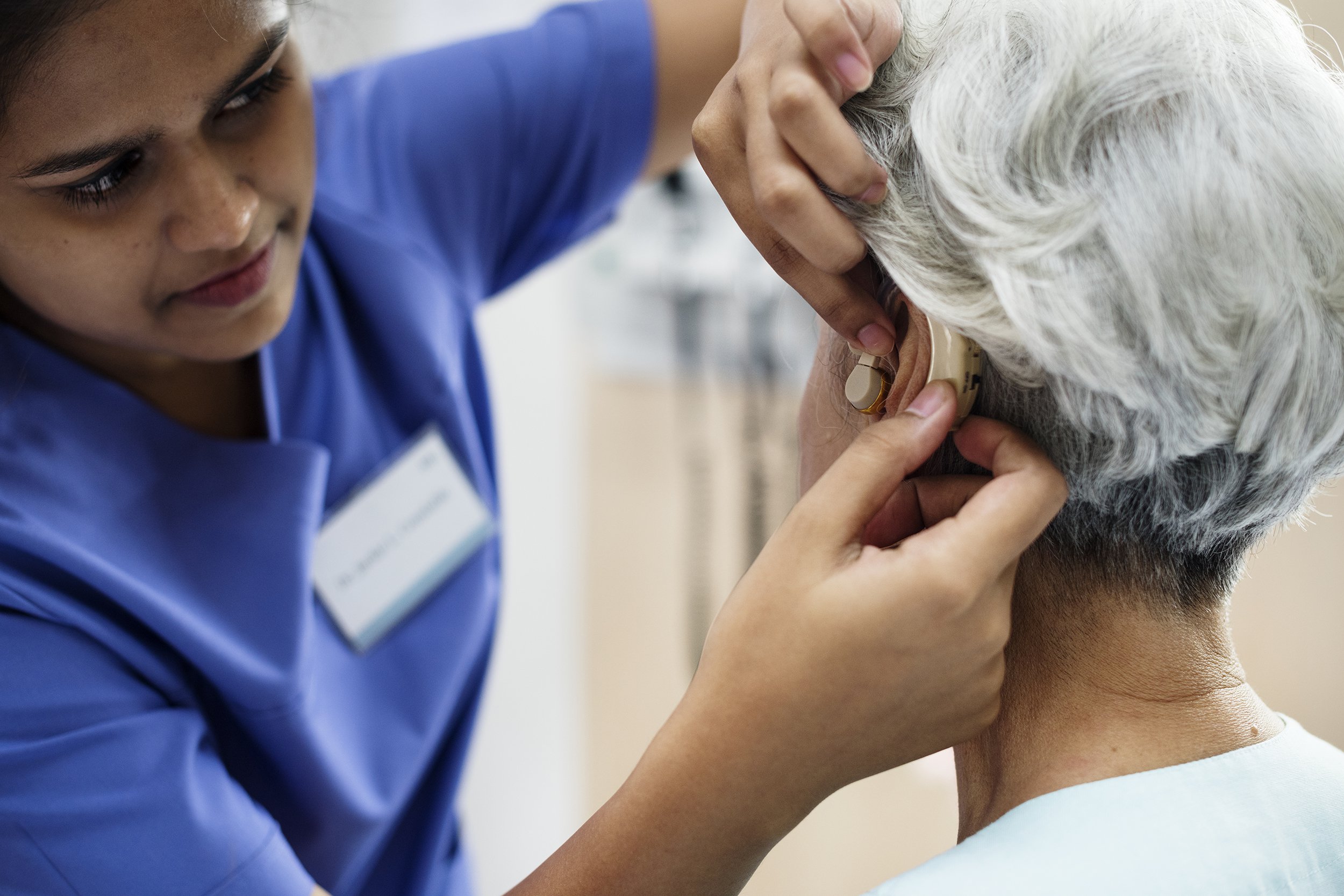 elderly woman with hearing aid