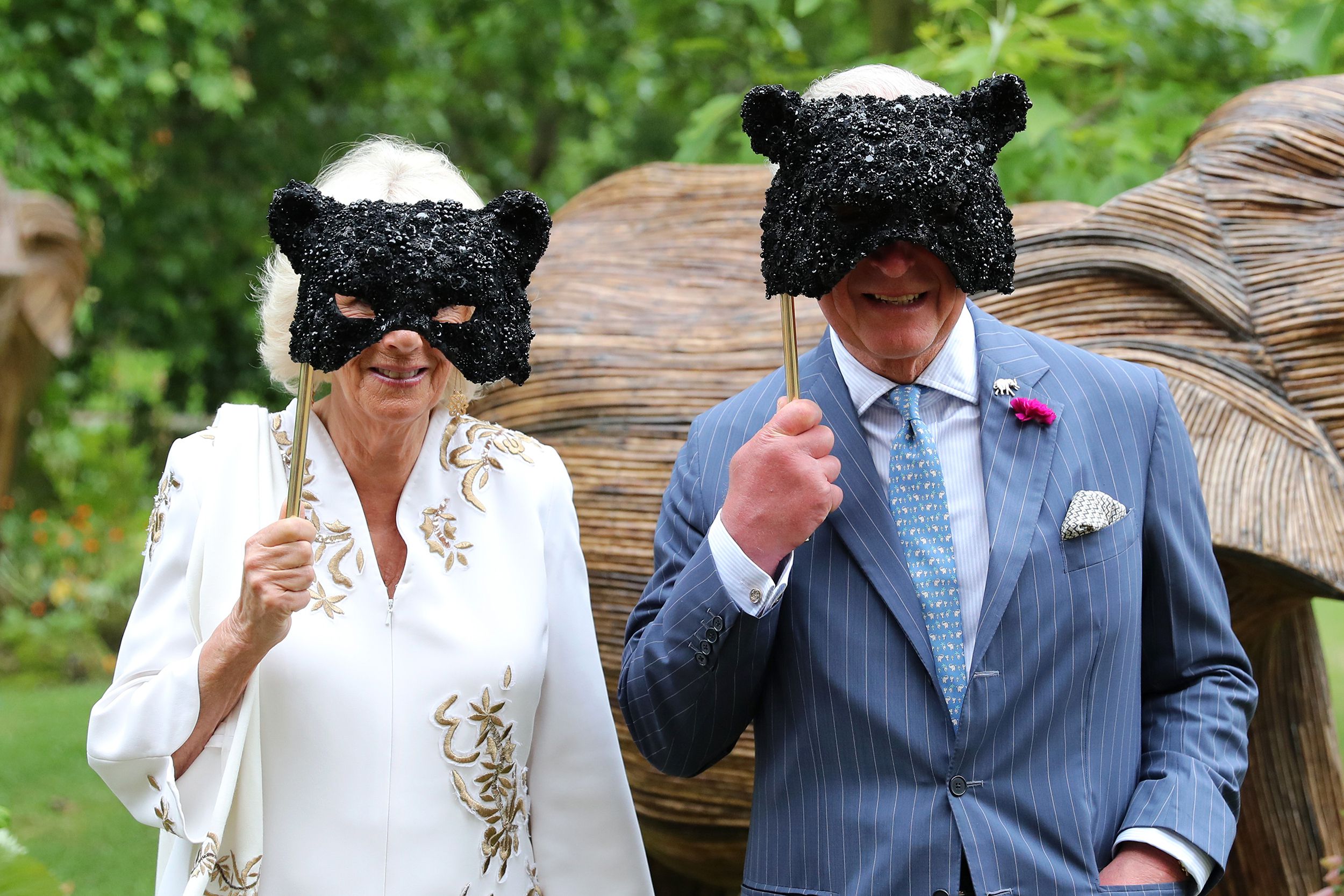 Camilla, Duchess of Cornwall and Prince Charles, Prince of Wales hold face masks as they host a reception for the Elephant Family Animal Ball at Clarence House on June 13, 2019 in London, England. Elephant Family is an international NGO dedicated to prote