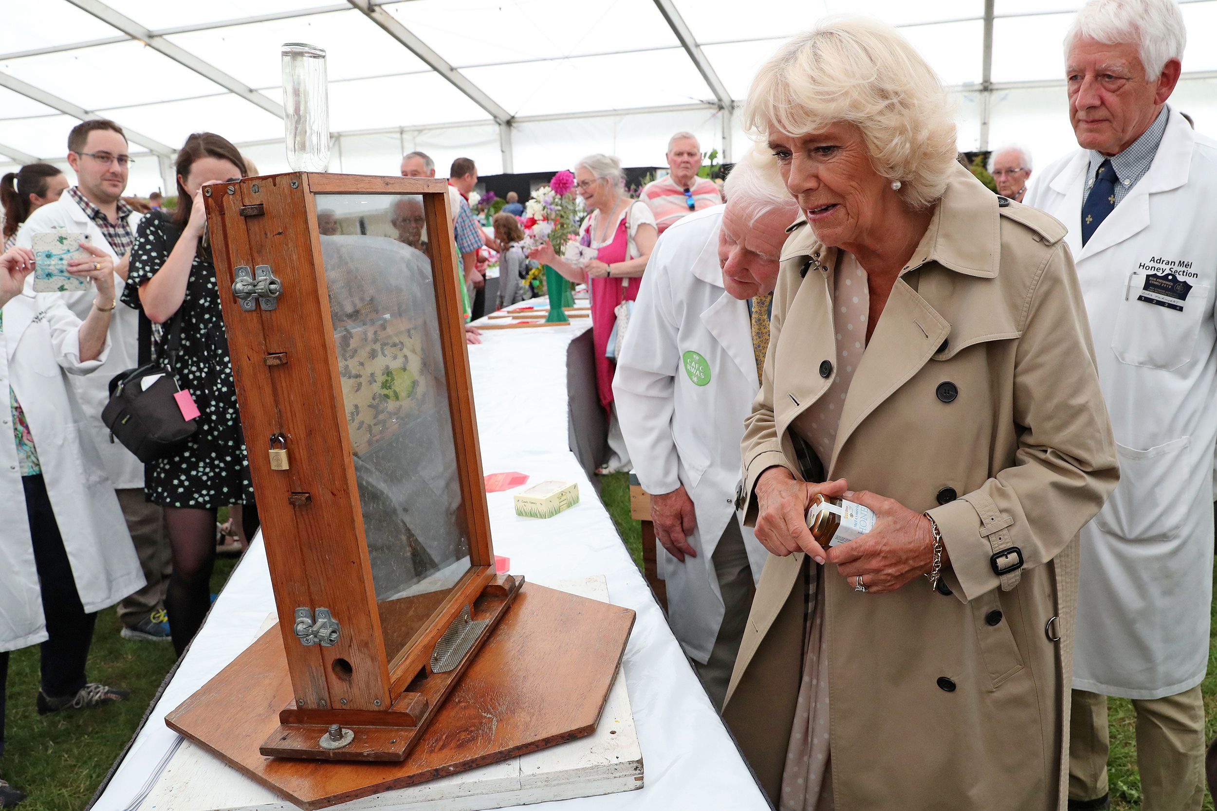 Camilla, Duchess of Cornwall visits the Floral Pavilion and views a display by the National Honey Show during the 100th Royal Welsh Show on July 22, 2019 in Builth Wells, Wales.
