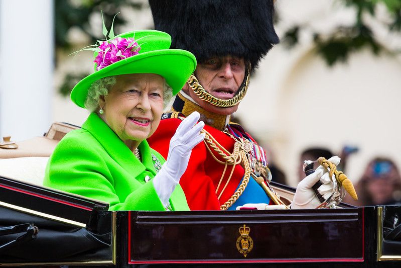 The birthday girl! Her Majesty The Queen waves to onlookers, accompanied by The Duke of Edinburgh.