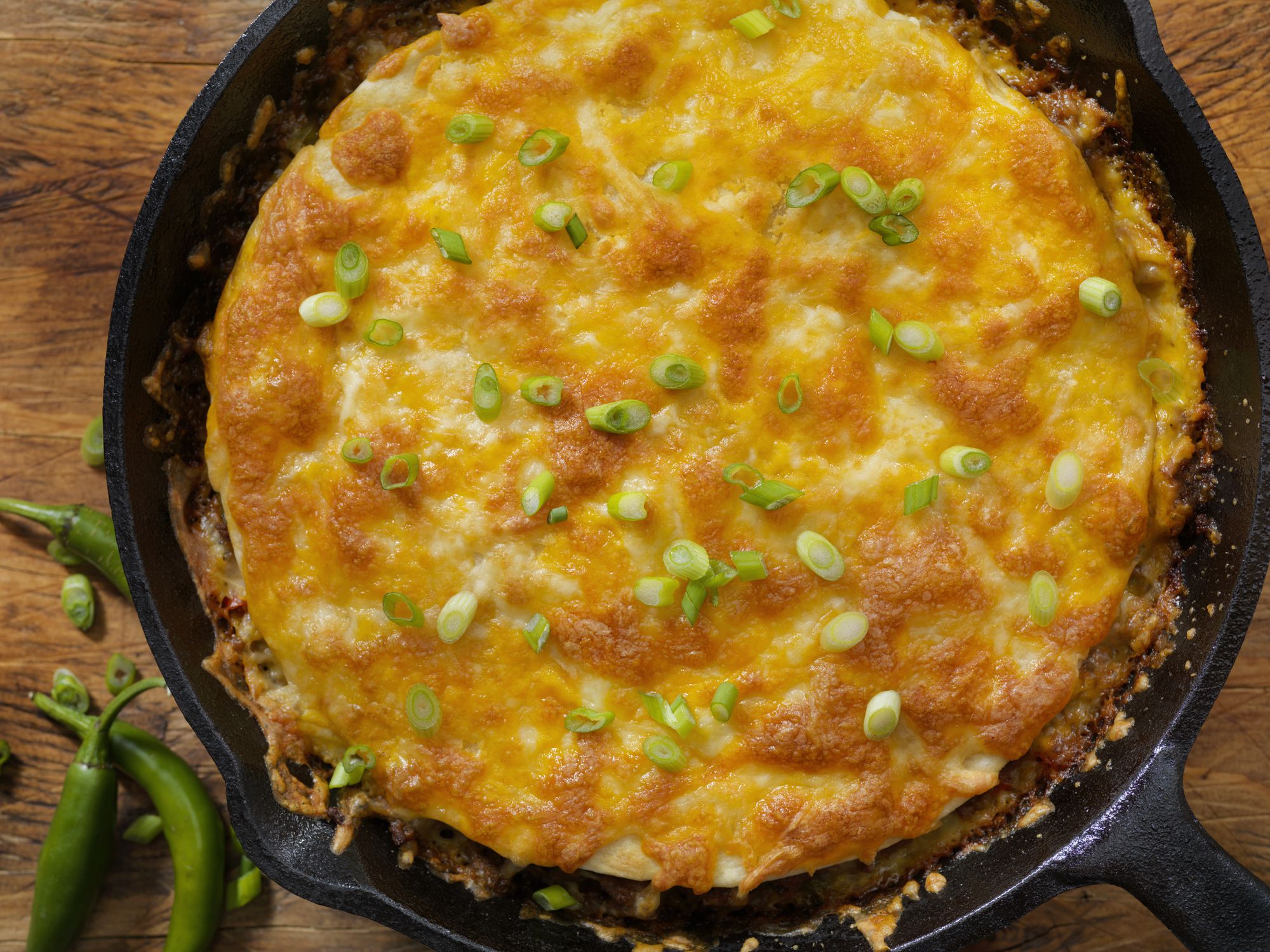 Layered Beef Taco Pie Baked in a Cast Iron Skillet