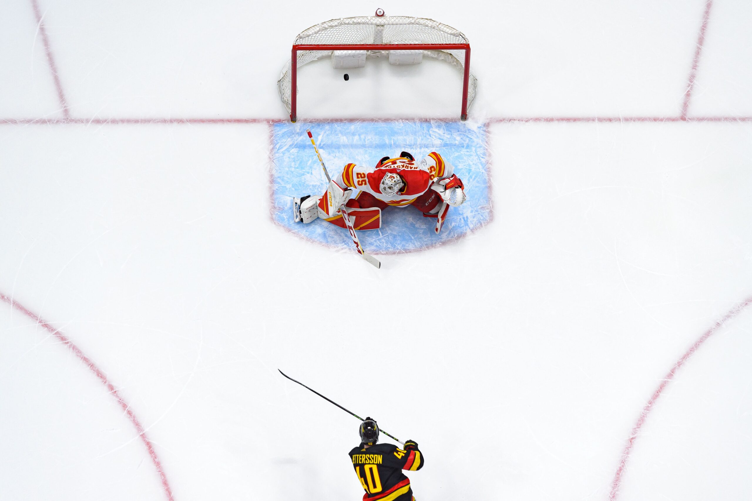 Elias Pettersson #40 of the Vancouver Canucks scores a goal on Jacob Markstrom #25 of the Calgary Flames during the first period of their NHL game at Rogers Arena on April 8, 2023 in Vancouver, British Columbia, Canada