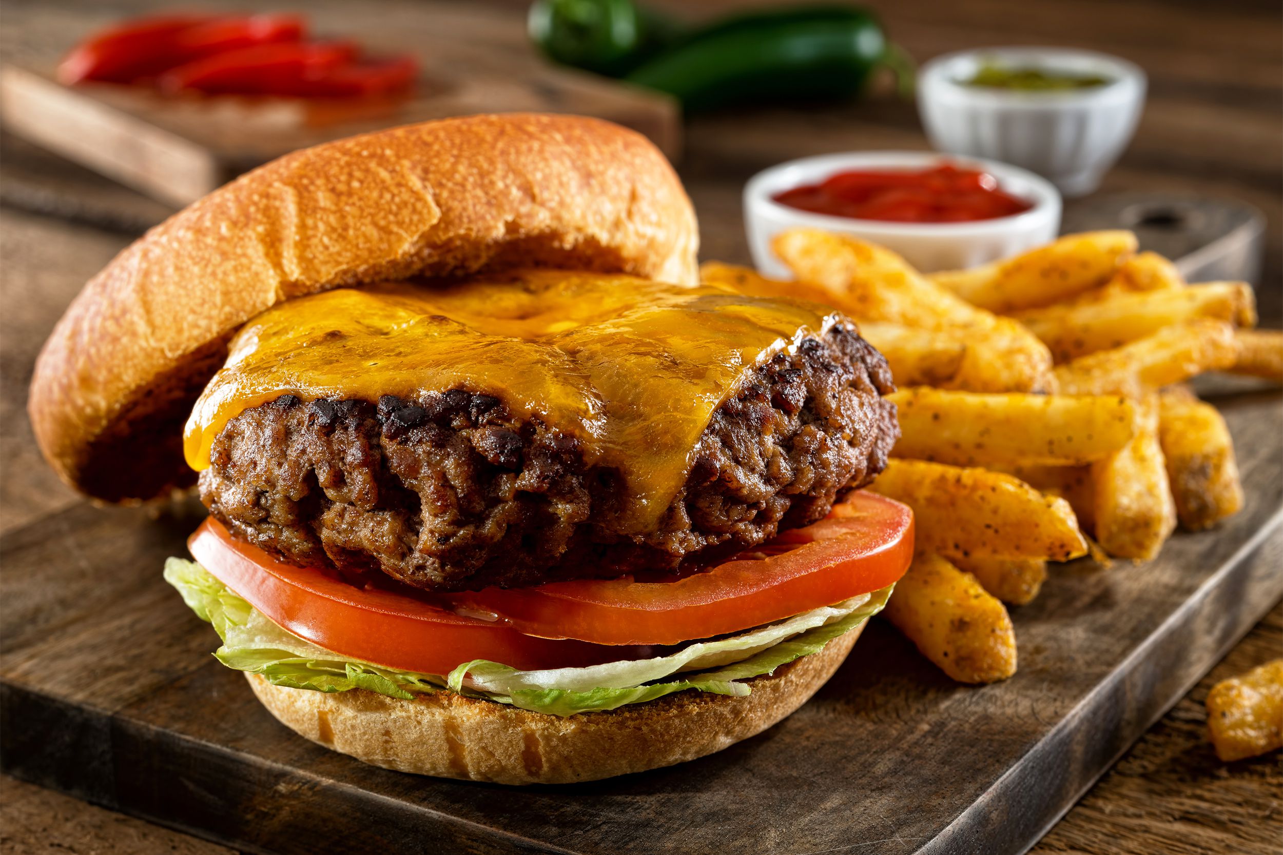 Thick Cheeseburger on toast bun with fries