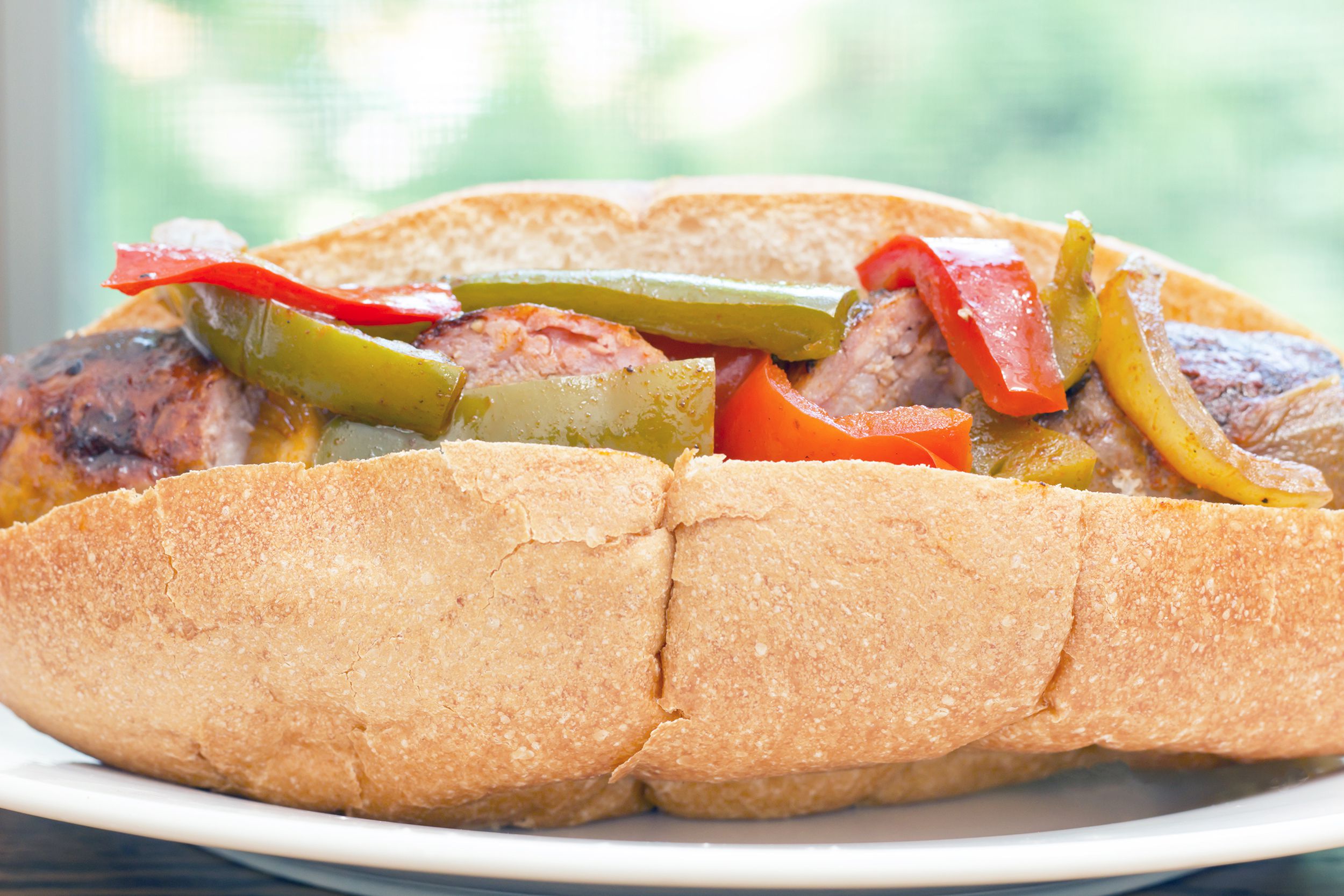 Sausage, Peppers, and Onions on bread roll