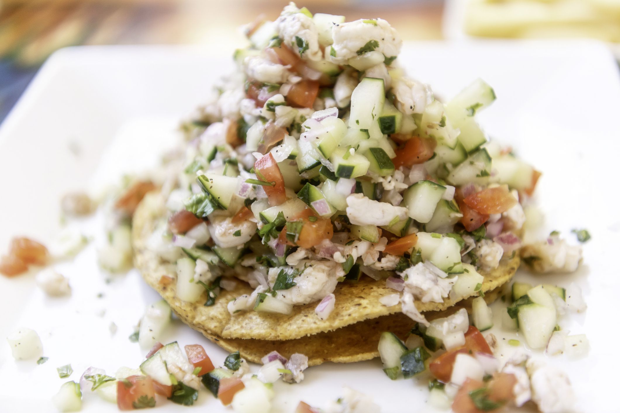 Mexican Shrimp Ceviche Tostada (Tostada de Ceviche de Camaron) in a restaurant table
