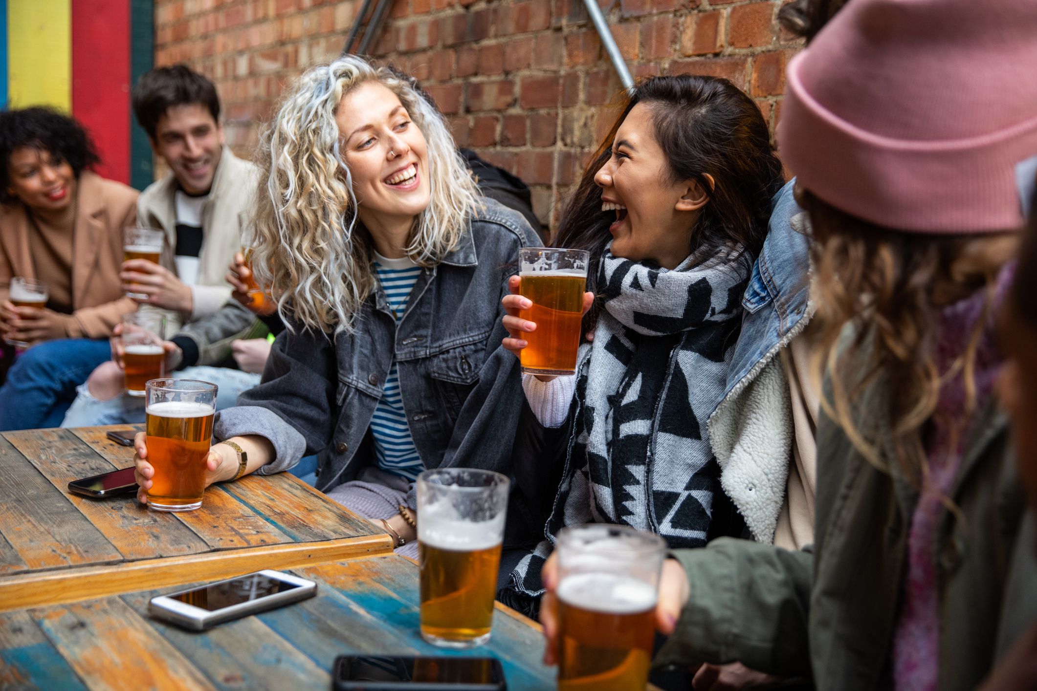 Londoners group of friends meet up in a pub
