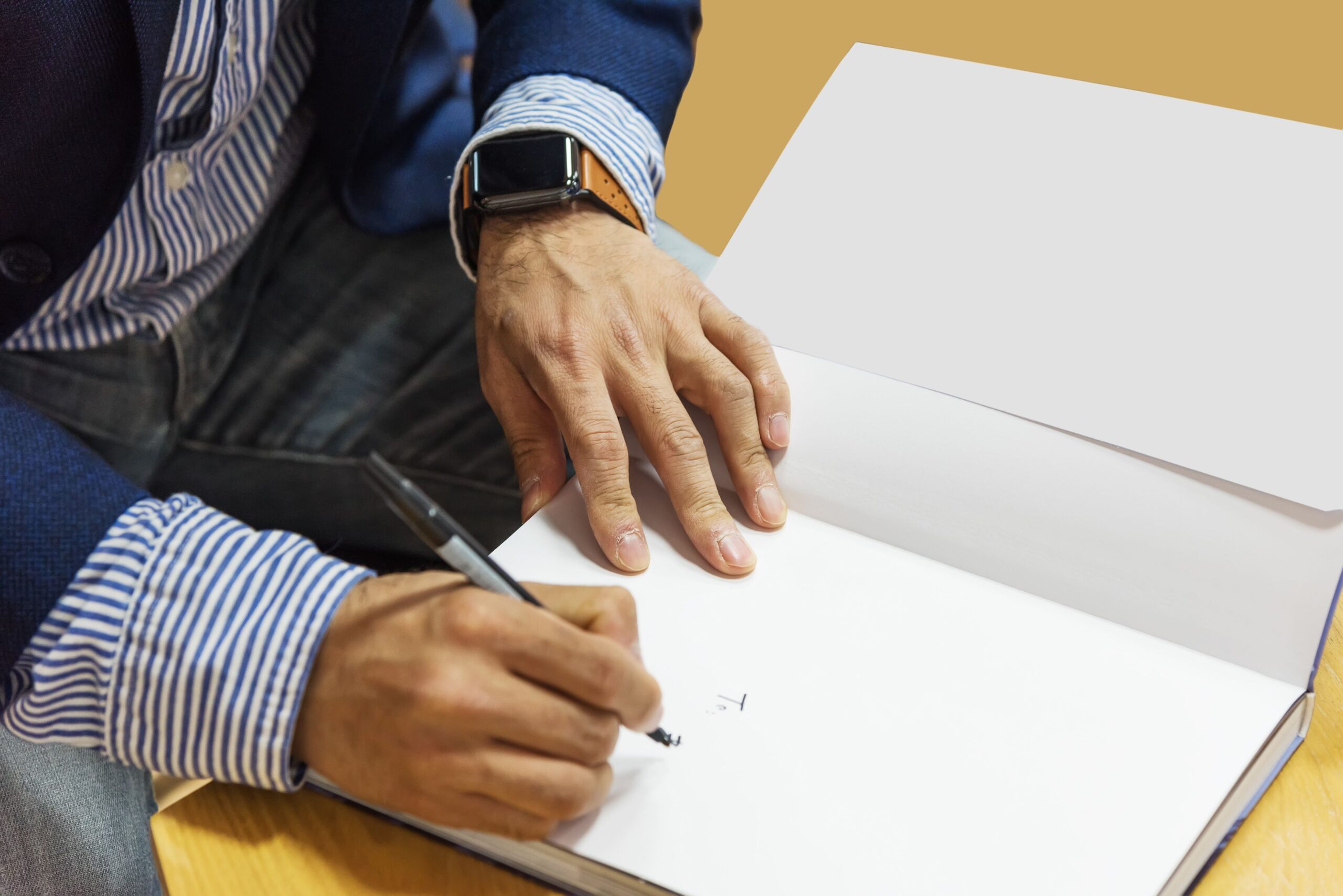Man autographing a book