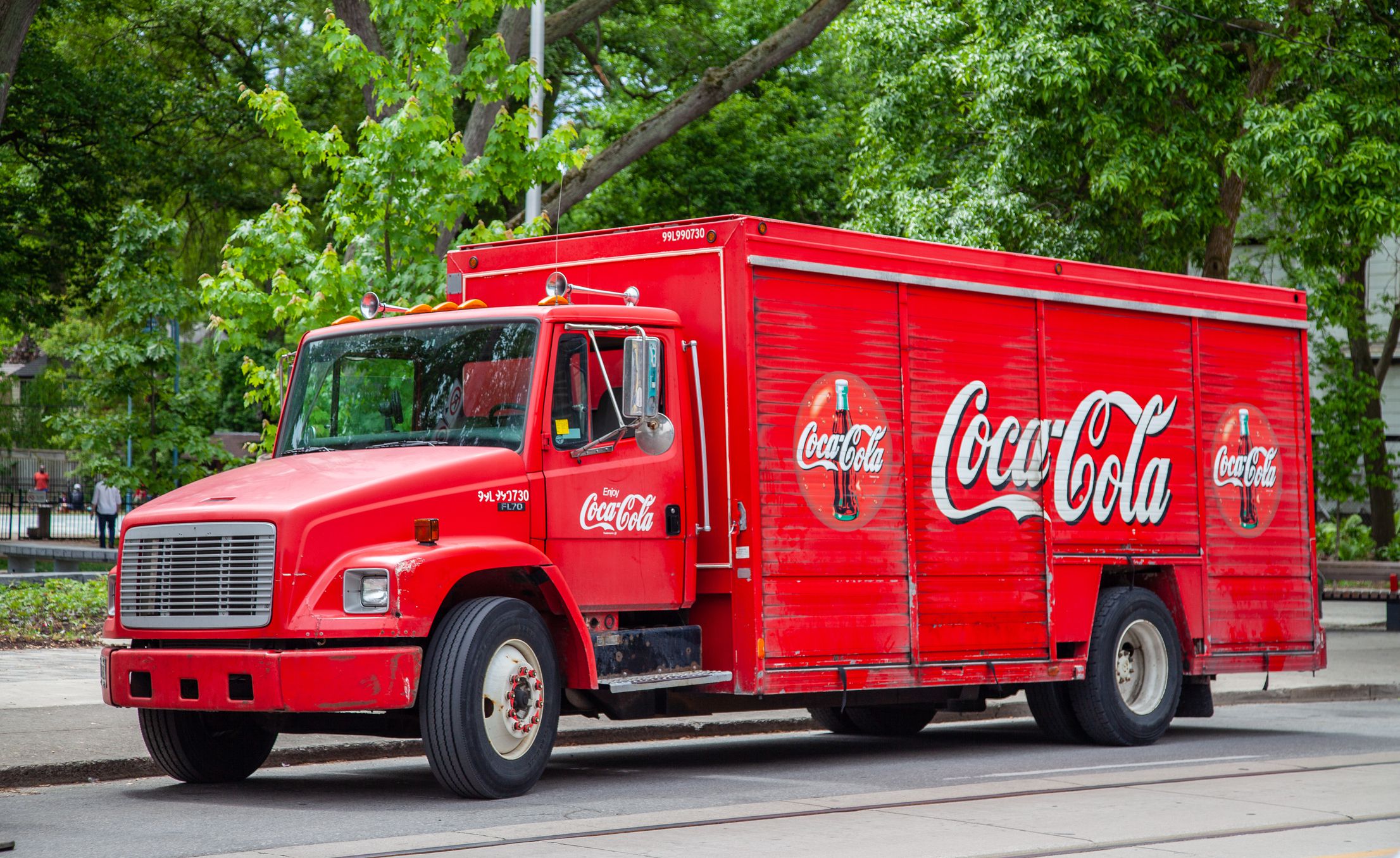 Red CocaCola Delivery Truck Parked on a street in the Beaches area of Toronto Ontario Canada on a Summer day
