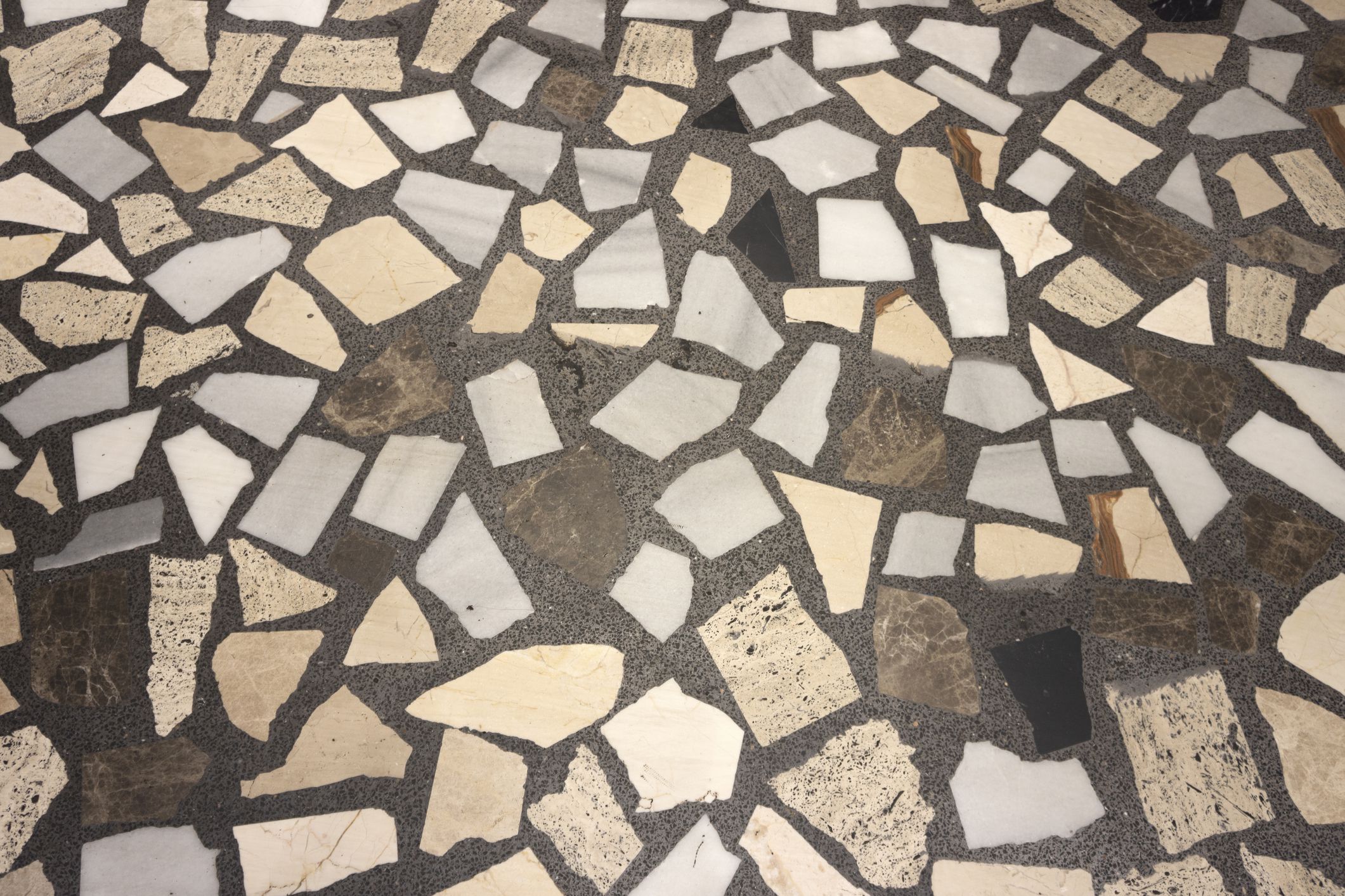 Texture of a pavement of colored marble pieces.