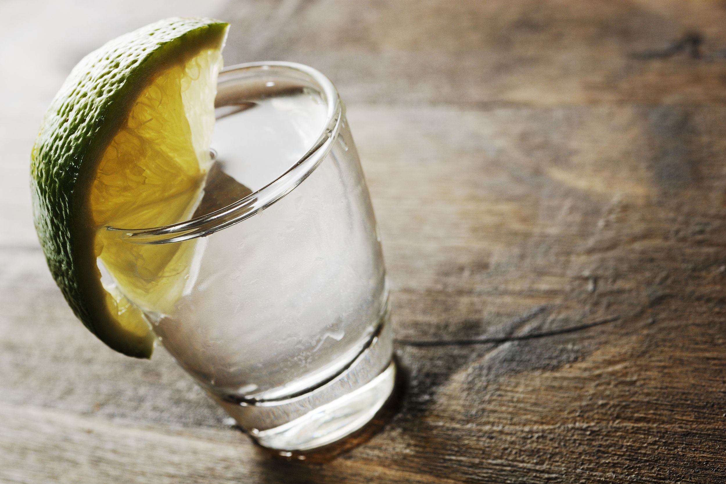 shot glass filled with blanco tequila
