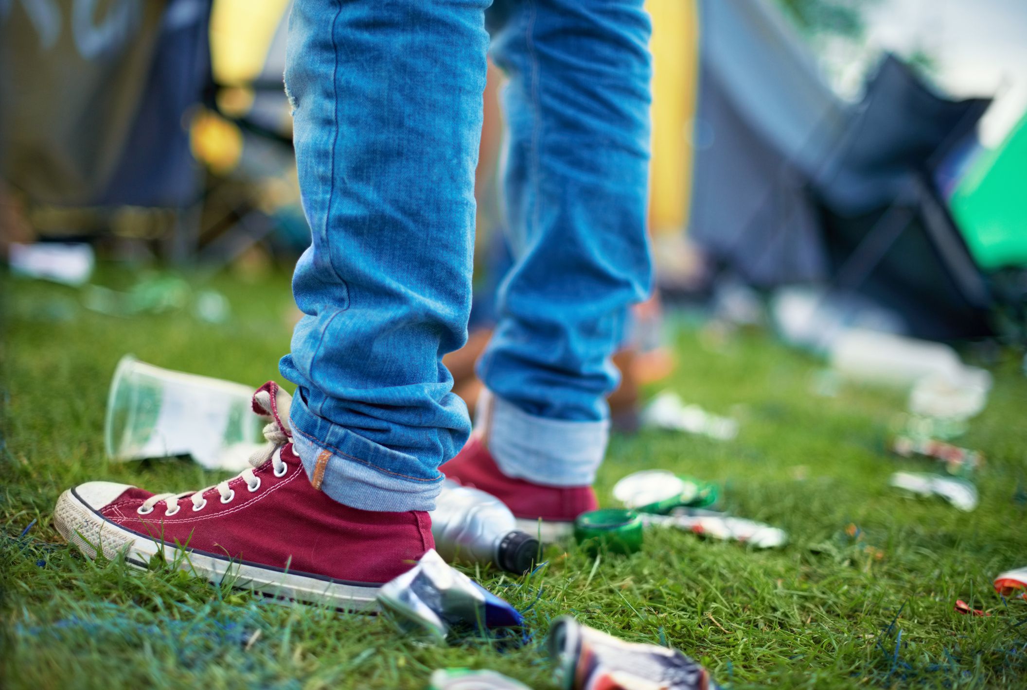 Closeup of someone's feet inbetween litter