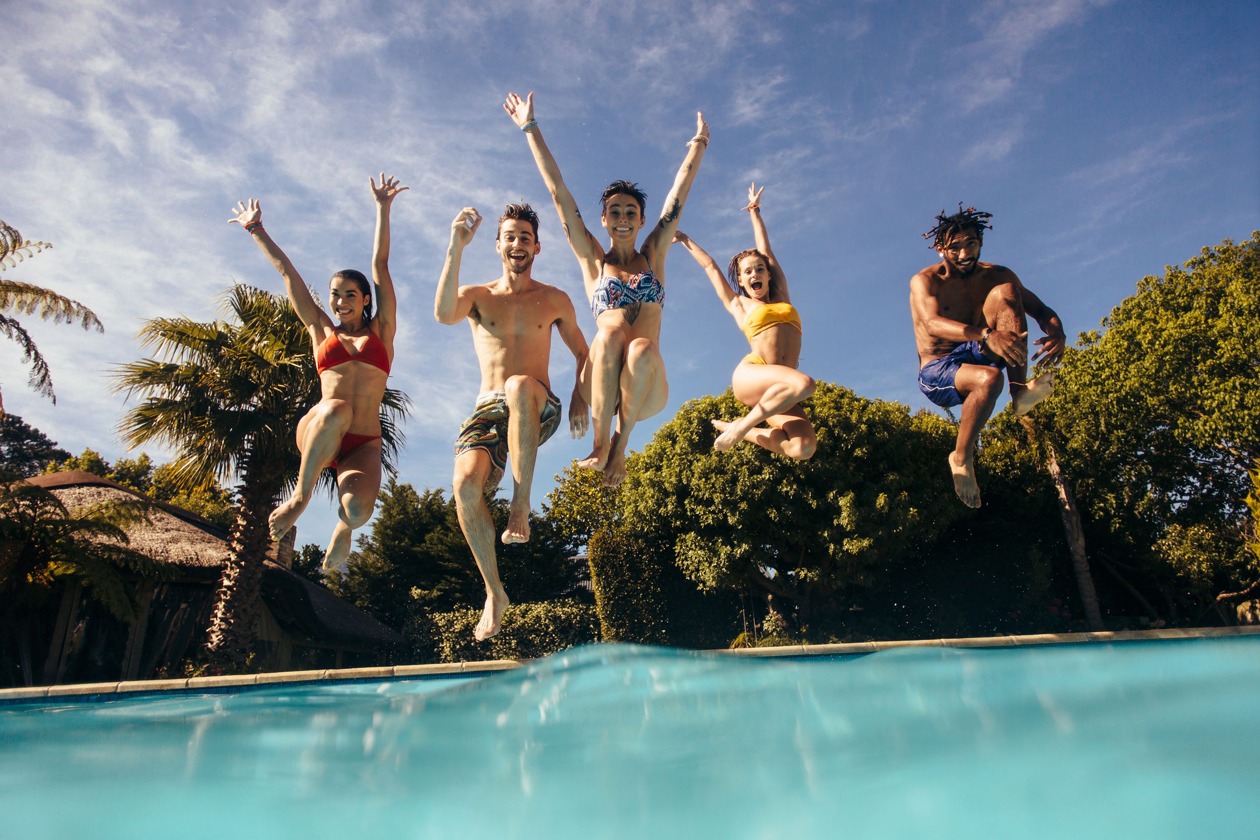 people jumping into public pool