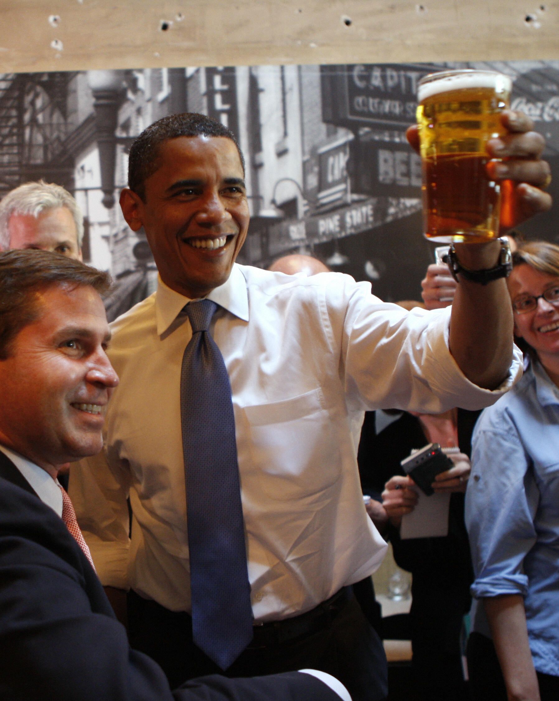 Democratic presidential candidate US Senator Barack Obama offers a toast while meeting with local residents at Raleigh Times bar in Raleigh, North Carolina, May 06, 2008. Voters in North Carolina and Indiana weighed in on the fates of Barack Obama and Hil