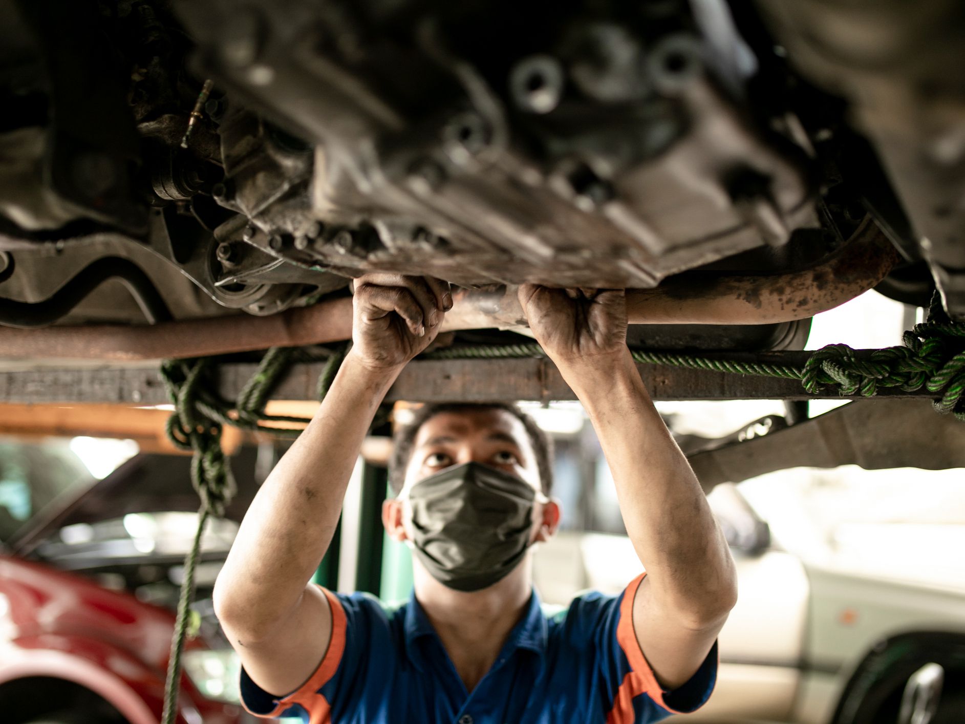Professional mechanic repairing a car in auto repair shop