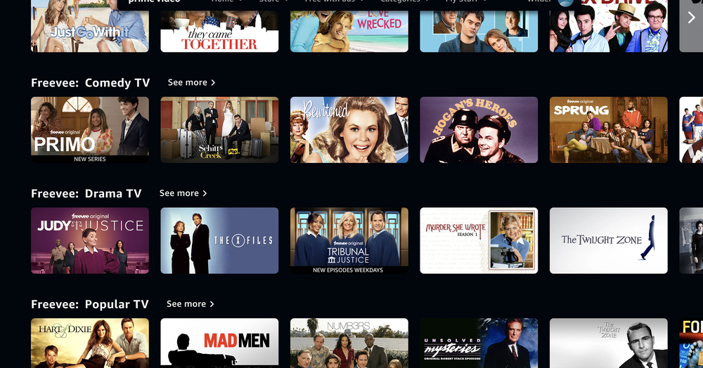 A streaming service interface displaying rows of TV shows under categories like Comedy TV, Drama TV, and Popular TV, with colorful show thumbnails and titles arranged in a grid layout.