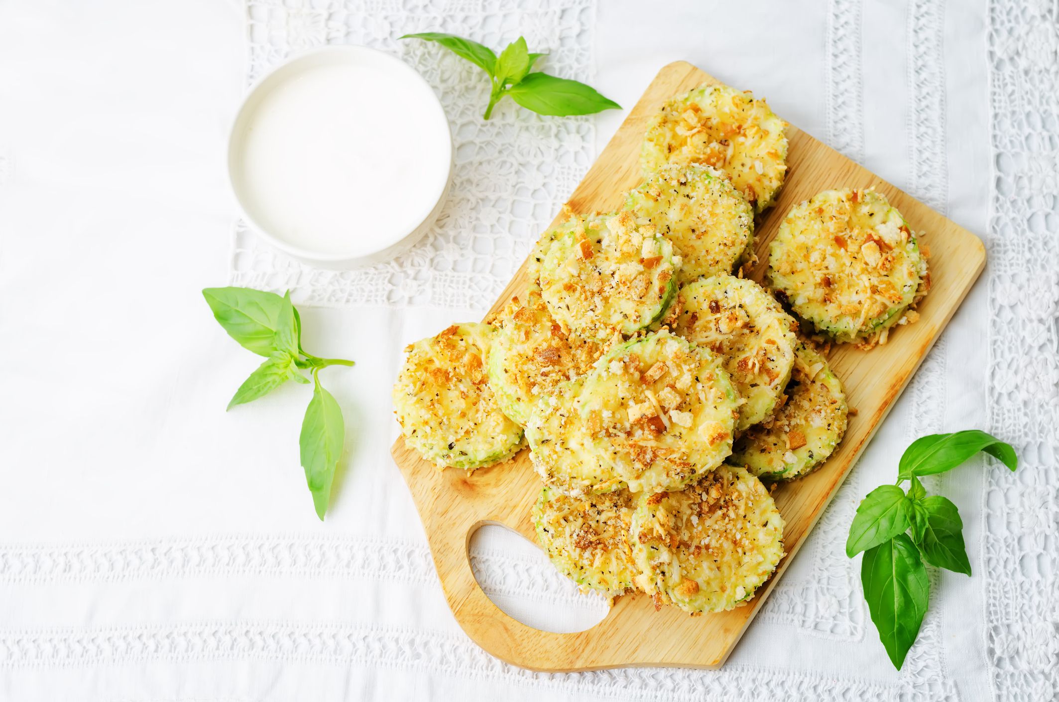 baked parmesan zucchini crisps with cream sauce. the toning. selective focus