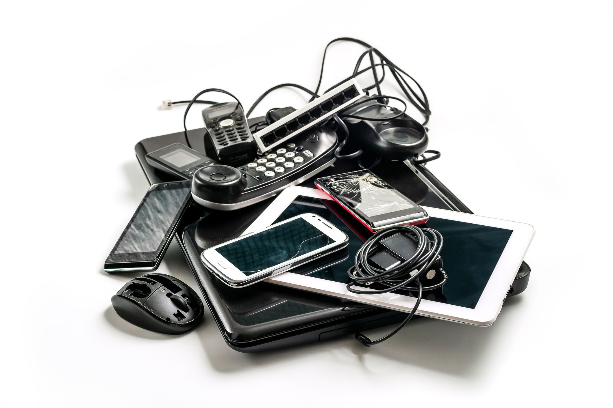 Electronic waste ready to recycle, isolated on white background. pile of mixed electronic waste, old broken computer parts, laptops, cell phones
