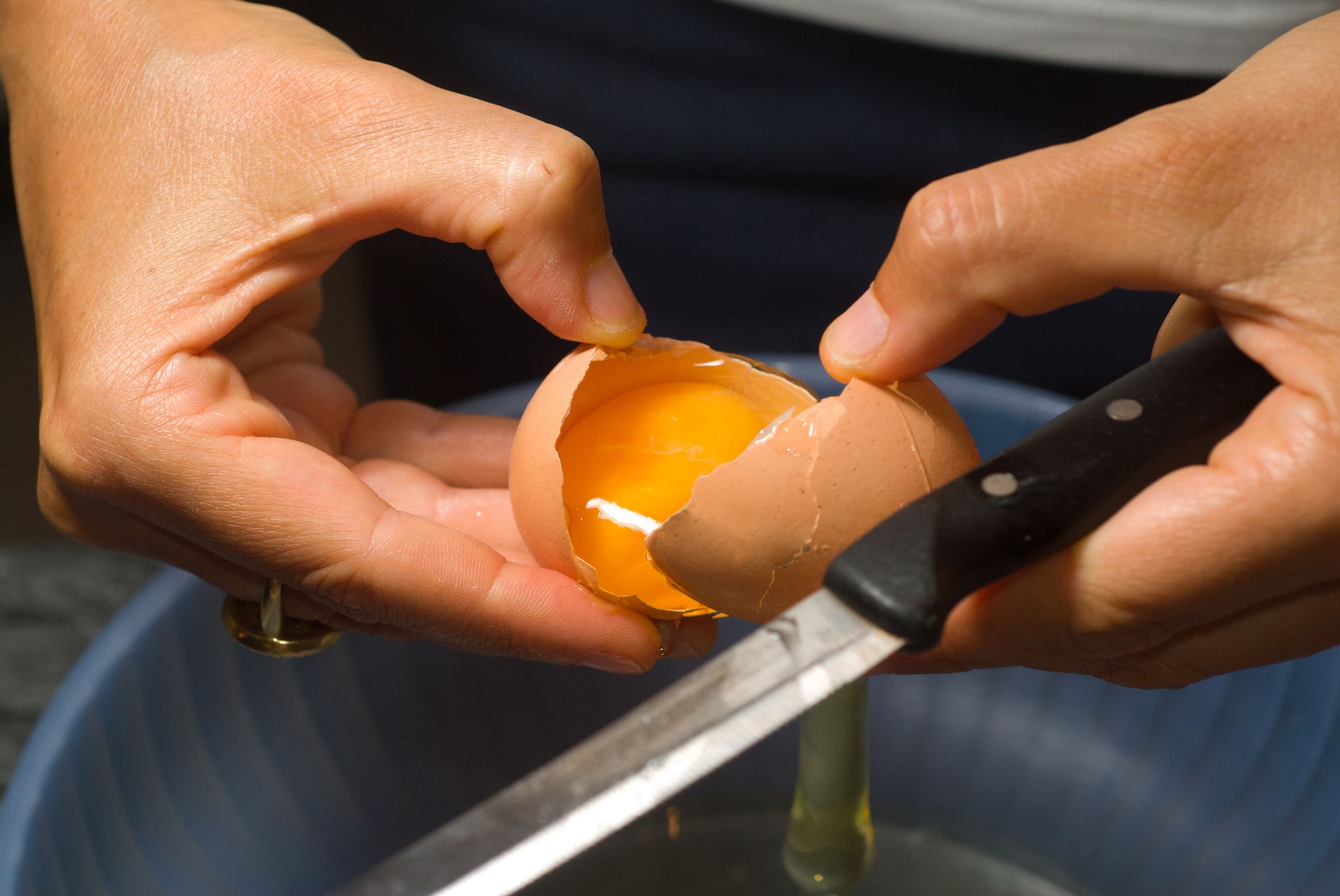 Opening and egg to part yolk from white.