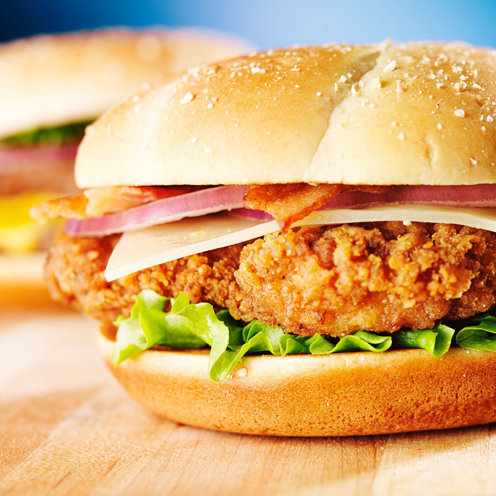 crispy chicken sandwich with bacon close up, shoy with selective focus.