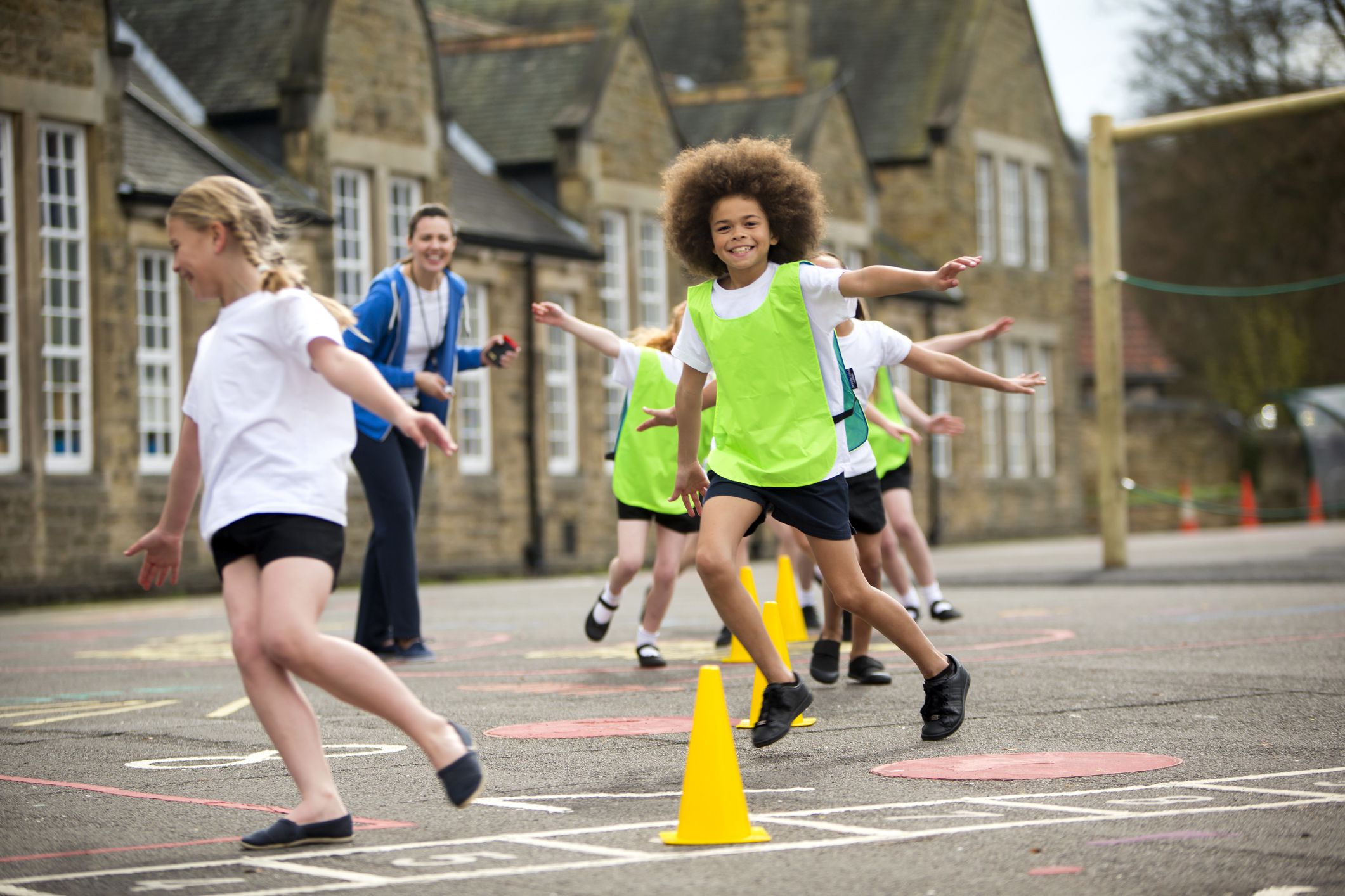 Children in the school playground during a physical education lesson