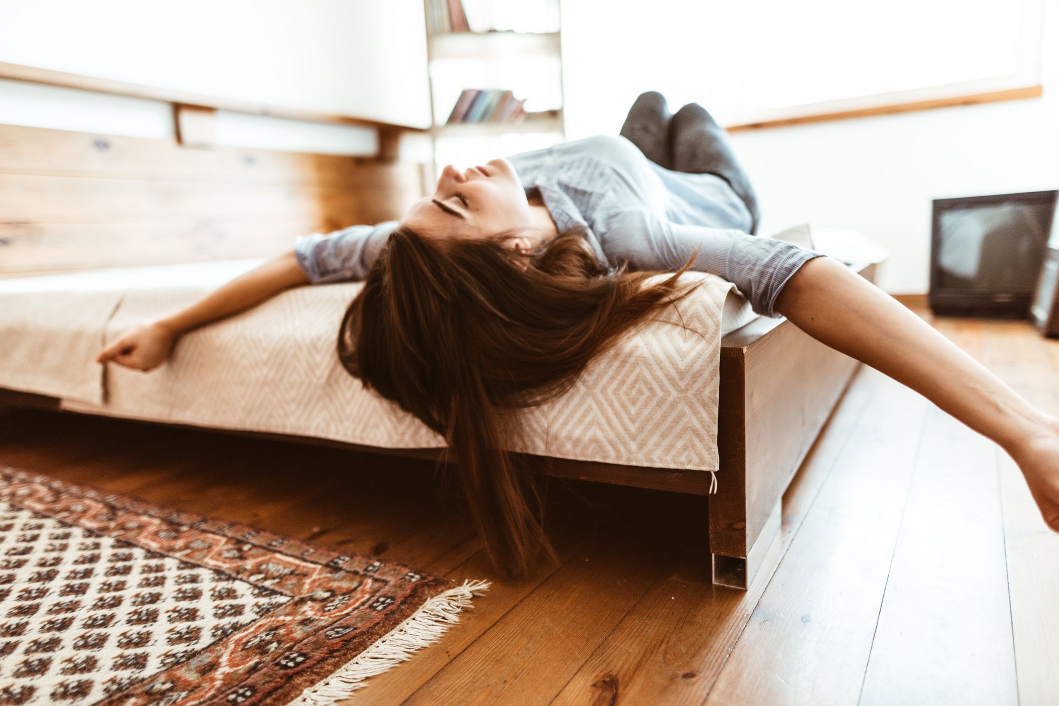 teenager womanwaking up in the bedroom at morning