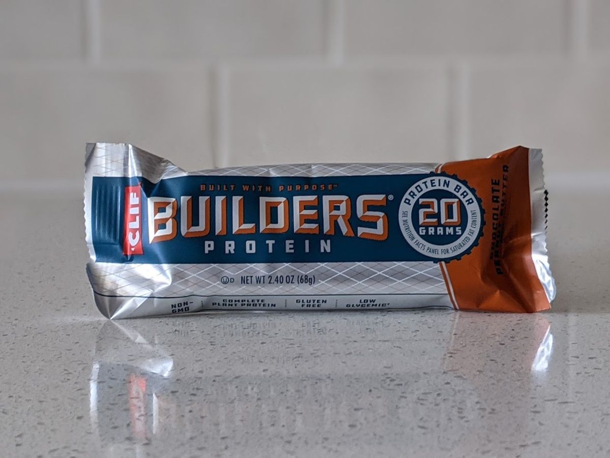 Clif Builders Protein Bar, Chocolate Peanut Butter, on a light grey countertop with light grey tiles in the background