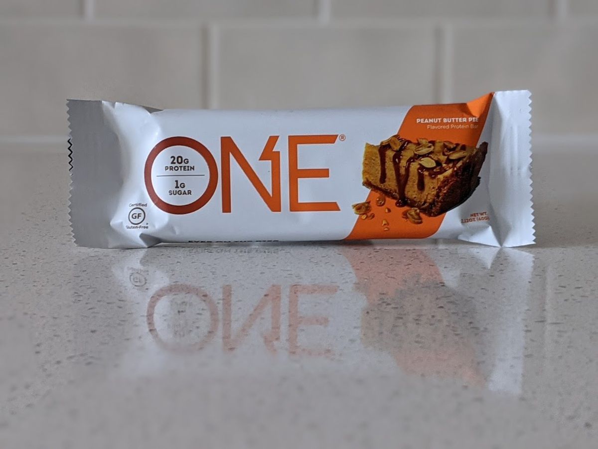 One Bar, Peanut Butter Pie, on a light grey countertop with light grey tiles in the background