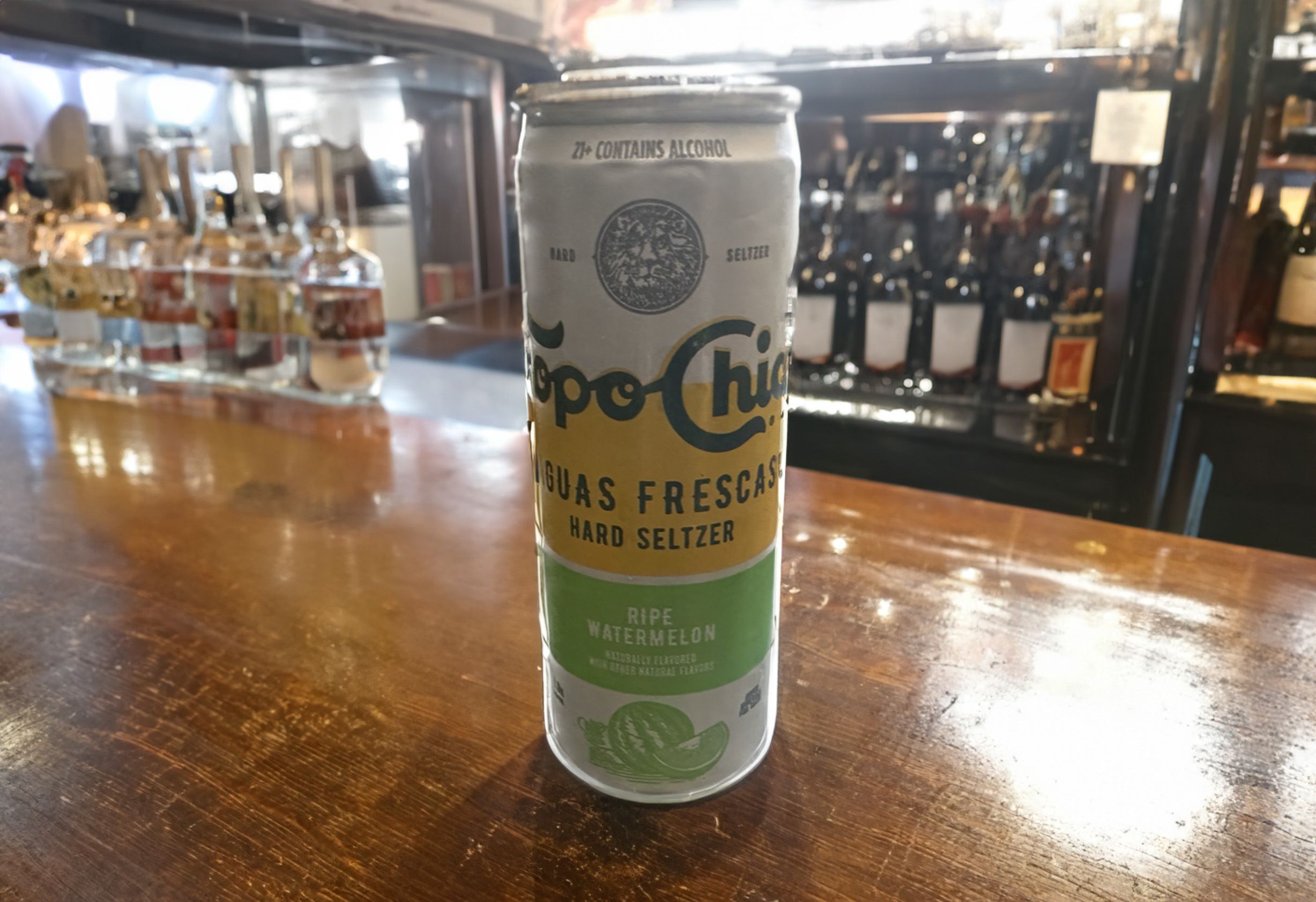 Ripe Watermelon Topo Chico hard seltzer on a bar