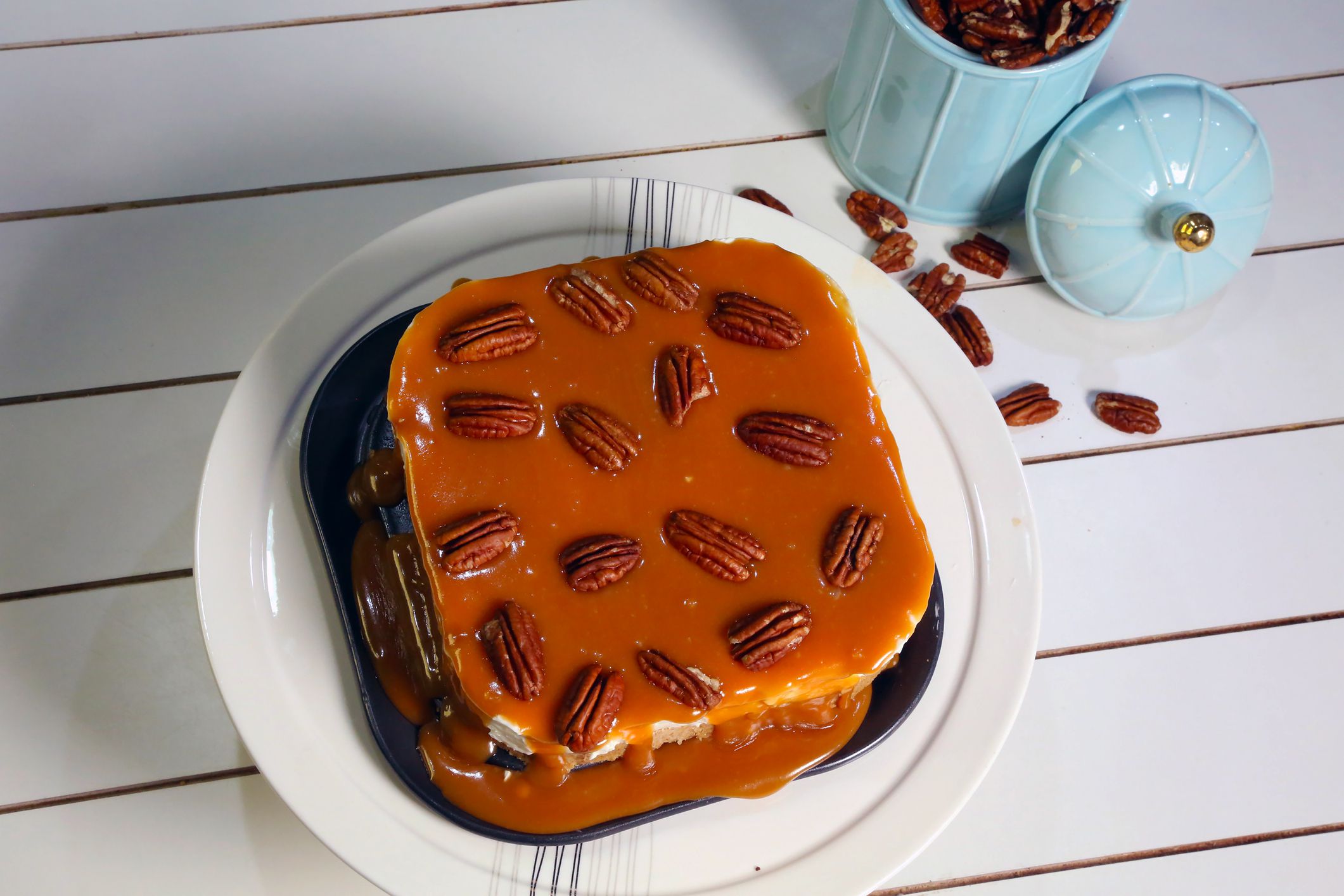 Picture of Homemade banana caramel cheesecake on plate and wooden background stock photo