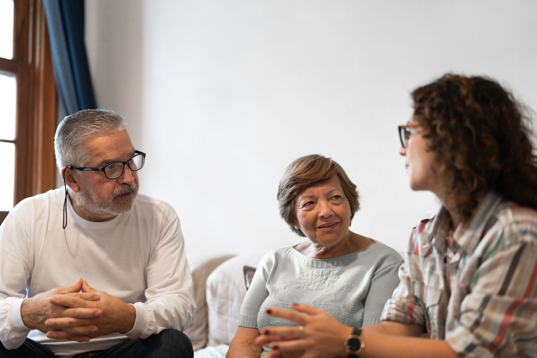 Family discussing in living room