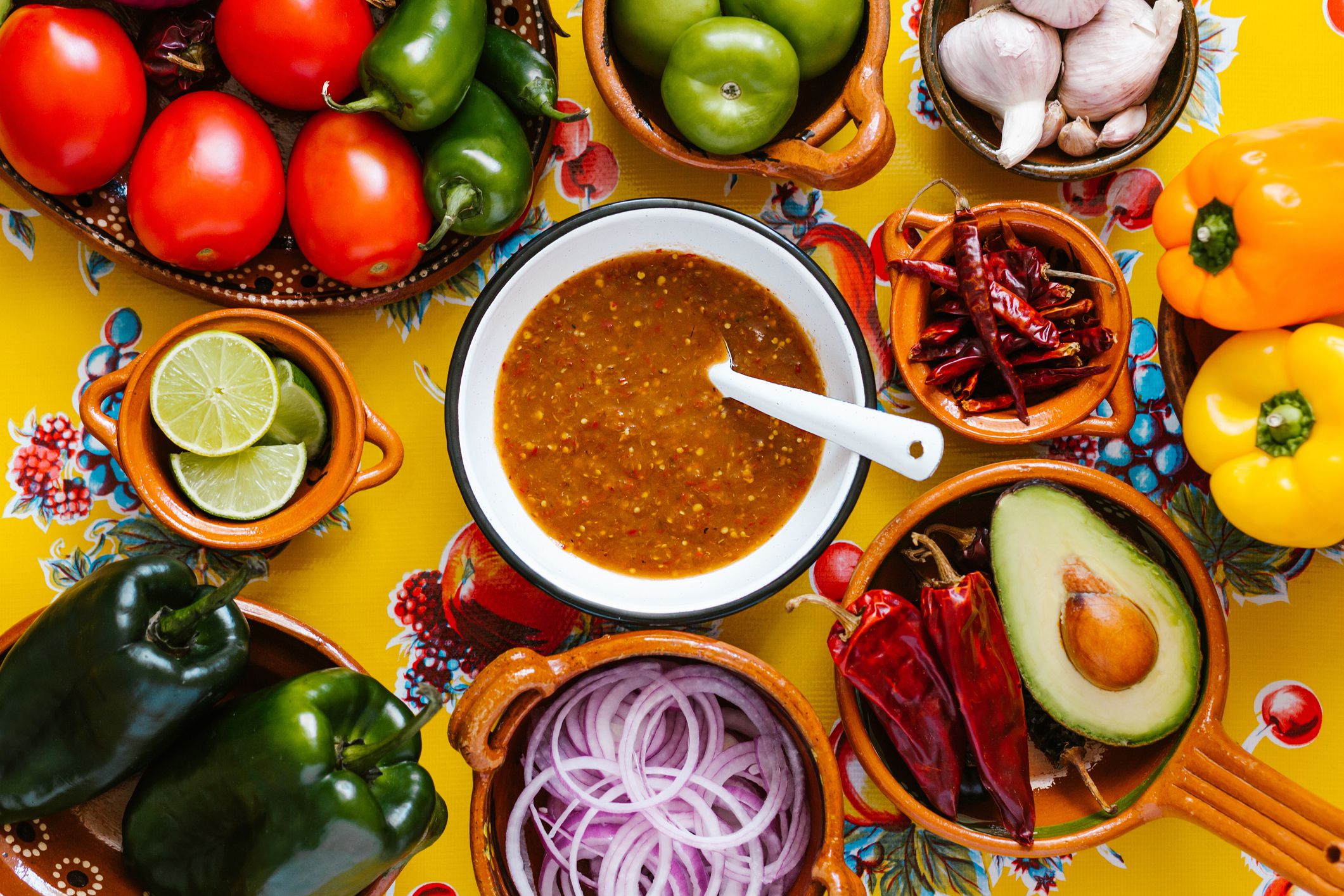 mexican salsa spicy sauce and ingredients on a table kitchen in Mexico city, Top view copy space.