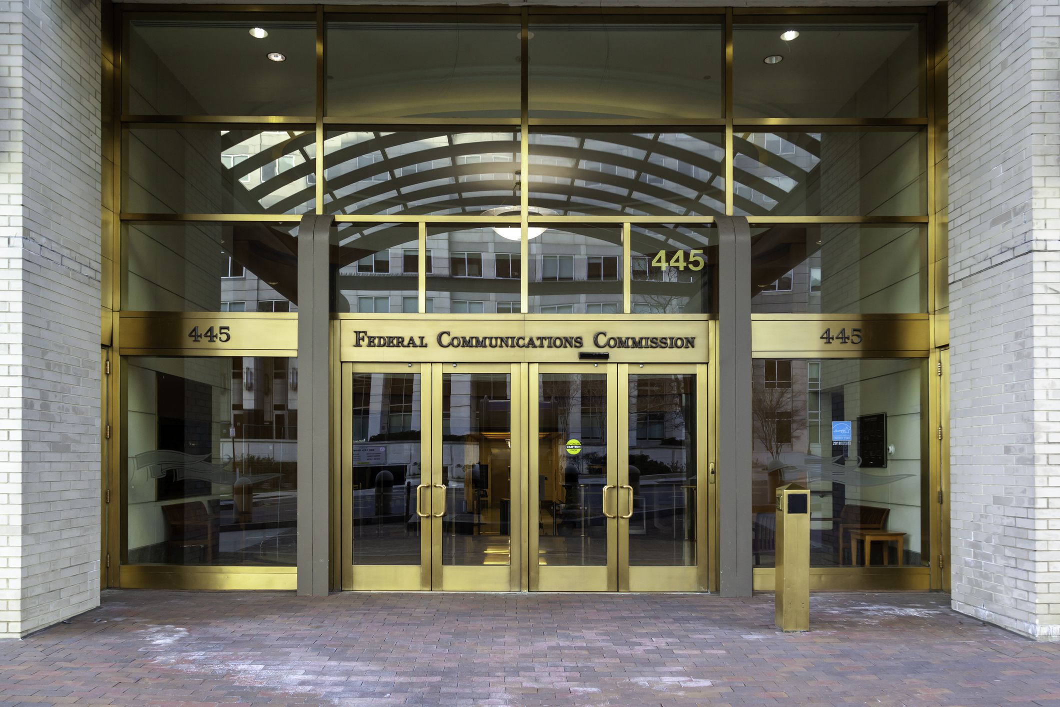 Washington, D.C., USA - February, 29, 2020: Entrance to Federal Communications Commission in Washington, D.C., USA. FCC is an independent agency of the USA government that regulates communications.