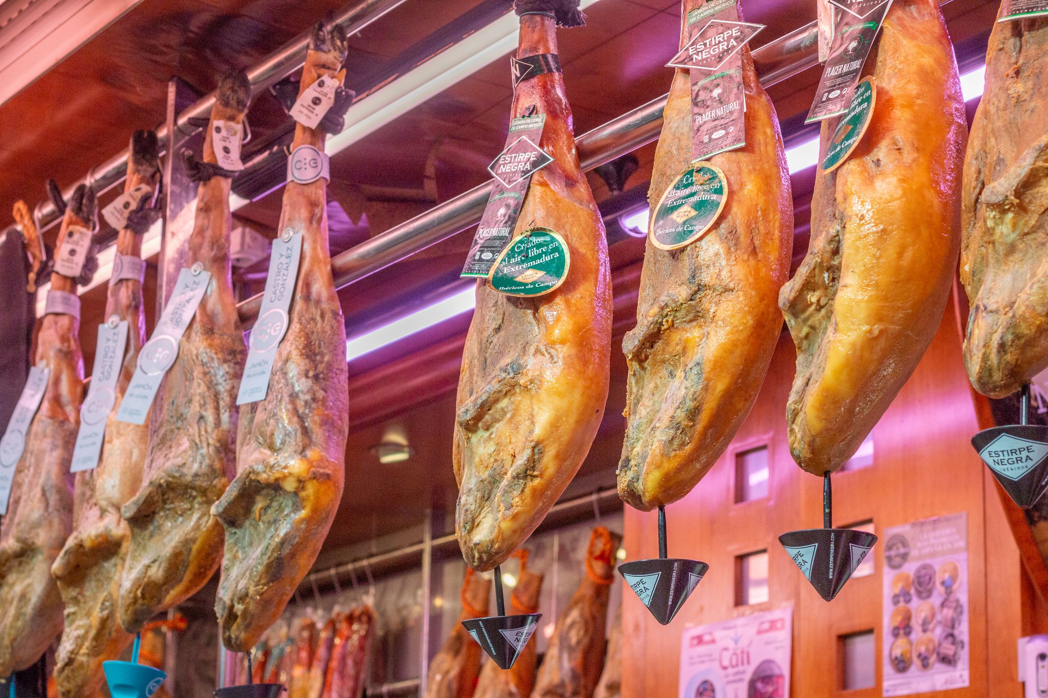 Jamón Serrano Ham at Mercado Central (Central Market) in Valencia, Spain, with commercial labels visible