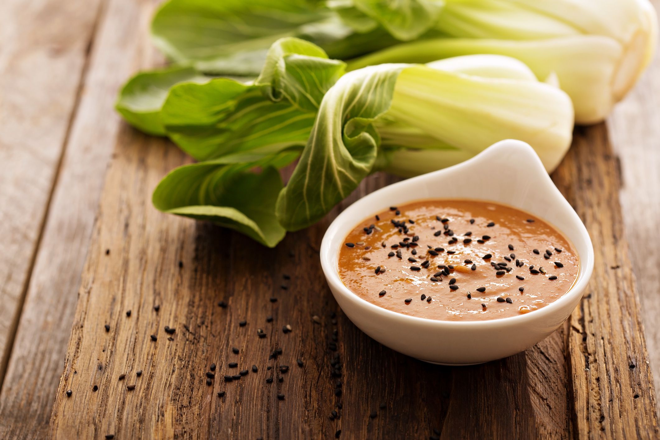 Homemade asian peanut dressing with black sesame seeds