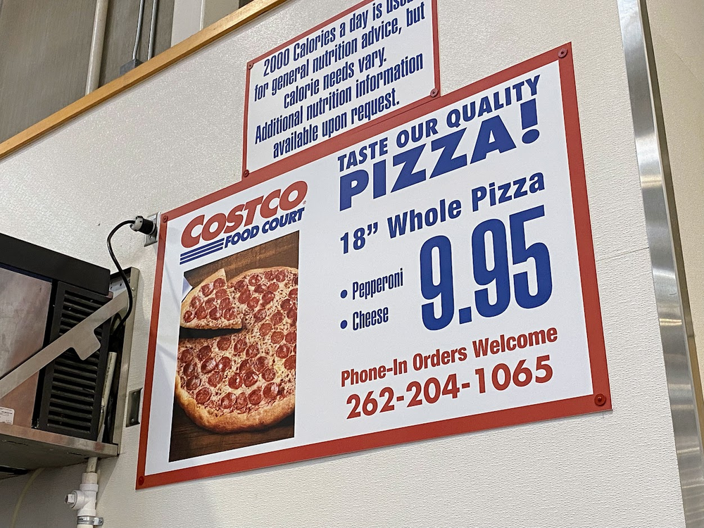 A sign at the Costco Food Court advertises an 18