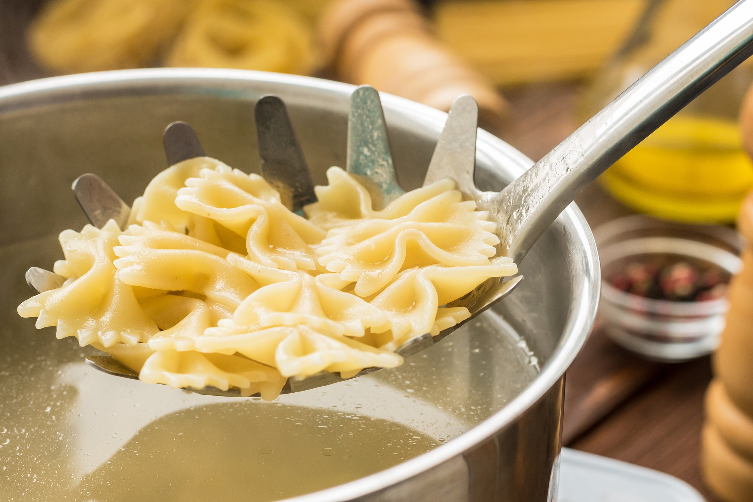 boiled farfalle on the pasta spoon