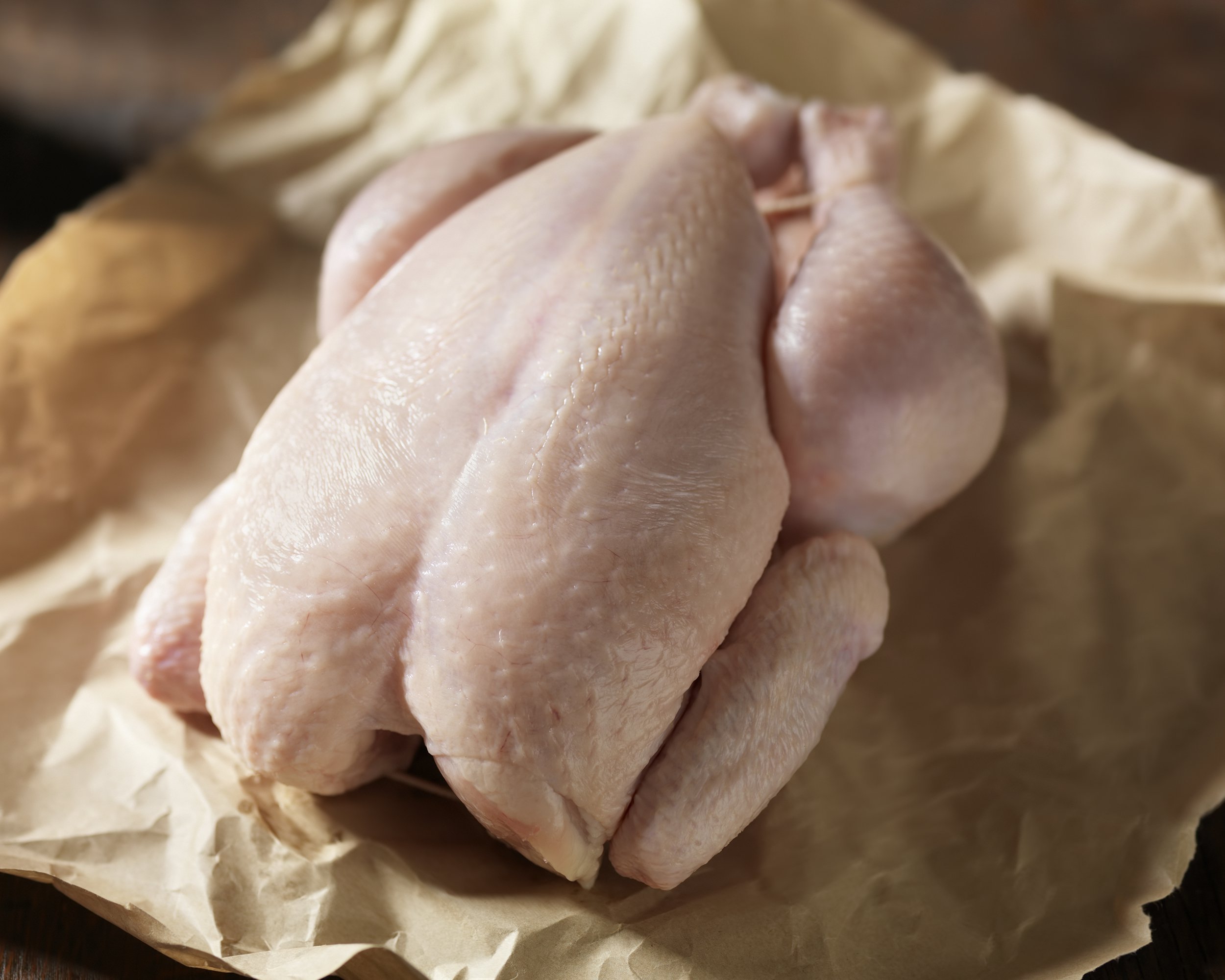 raw chicken in butchers paper