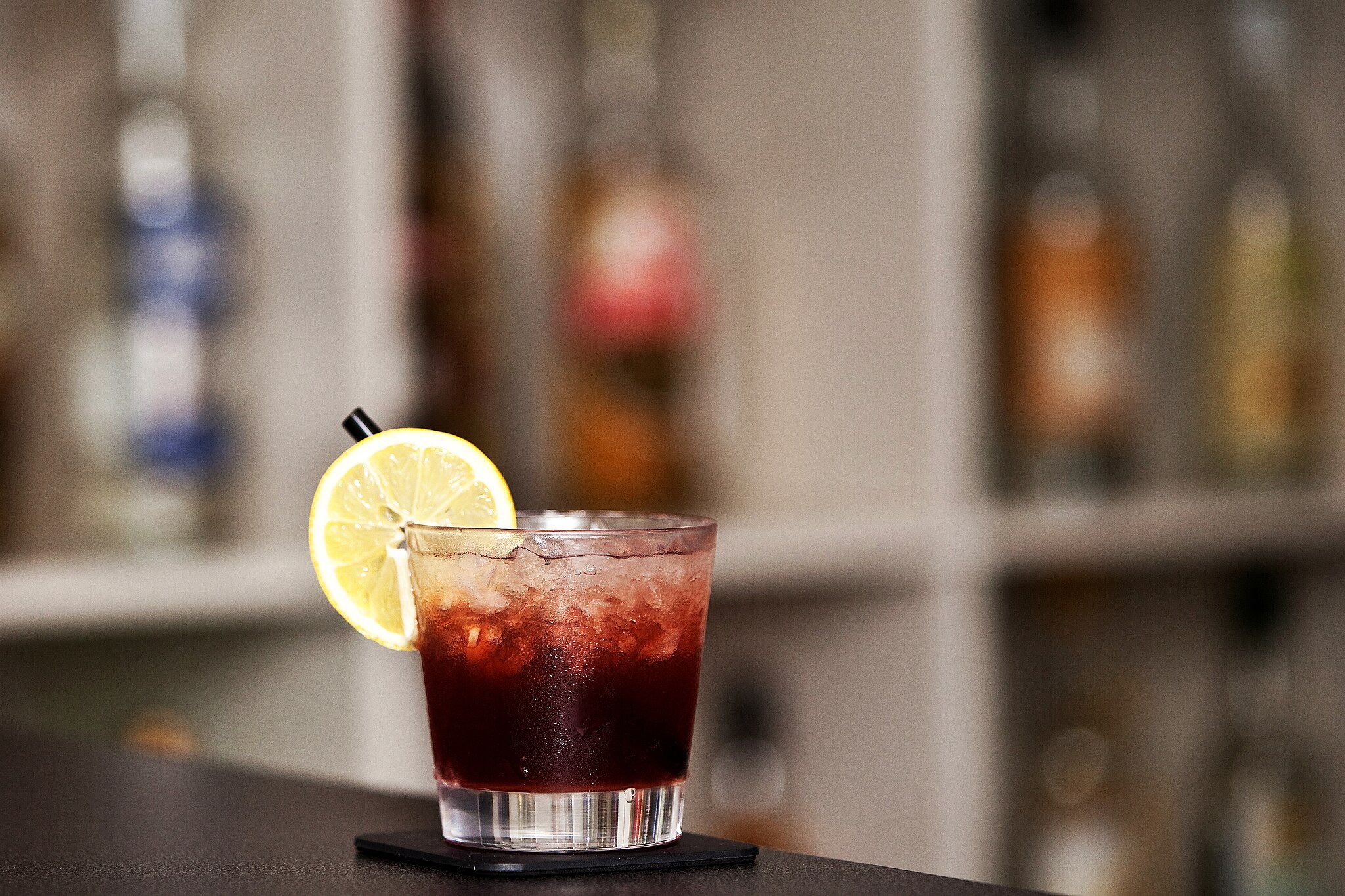 a blackberry cocktail with crushed ice