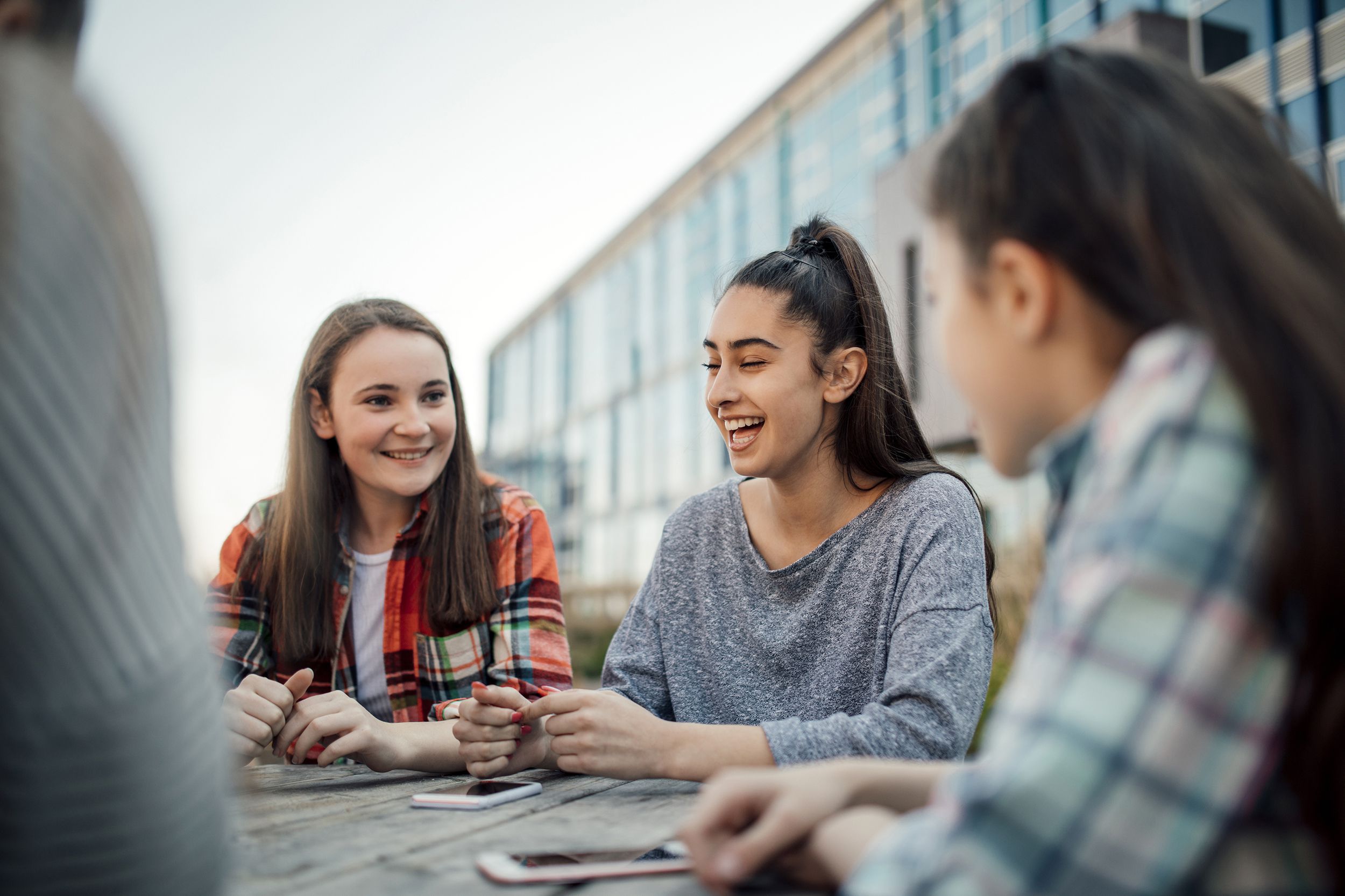Friends sitting together outside