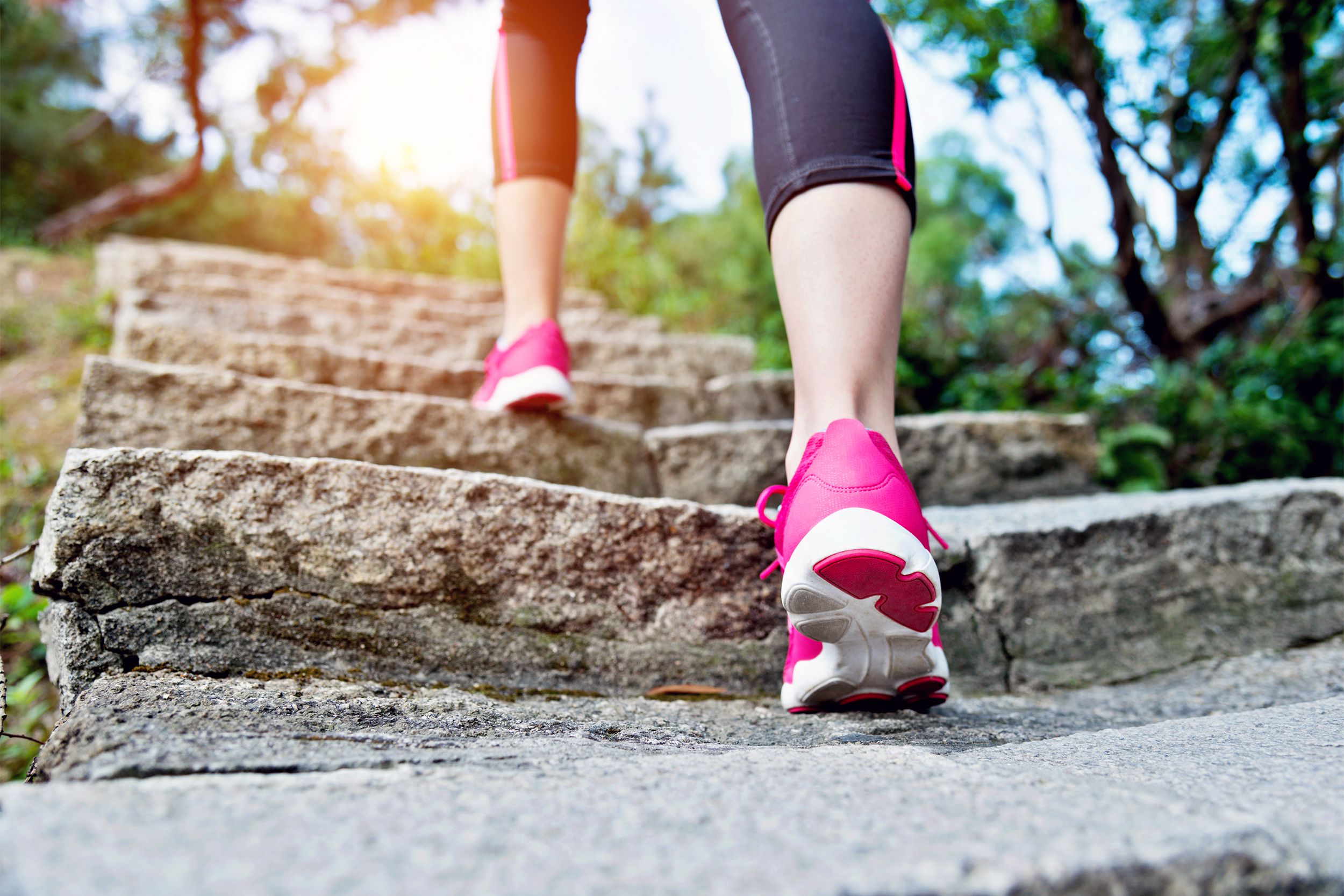 Closeup of athletic shoes running up stairs outside