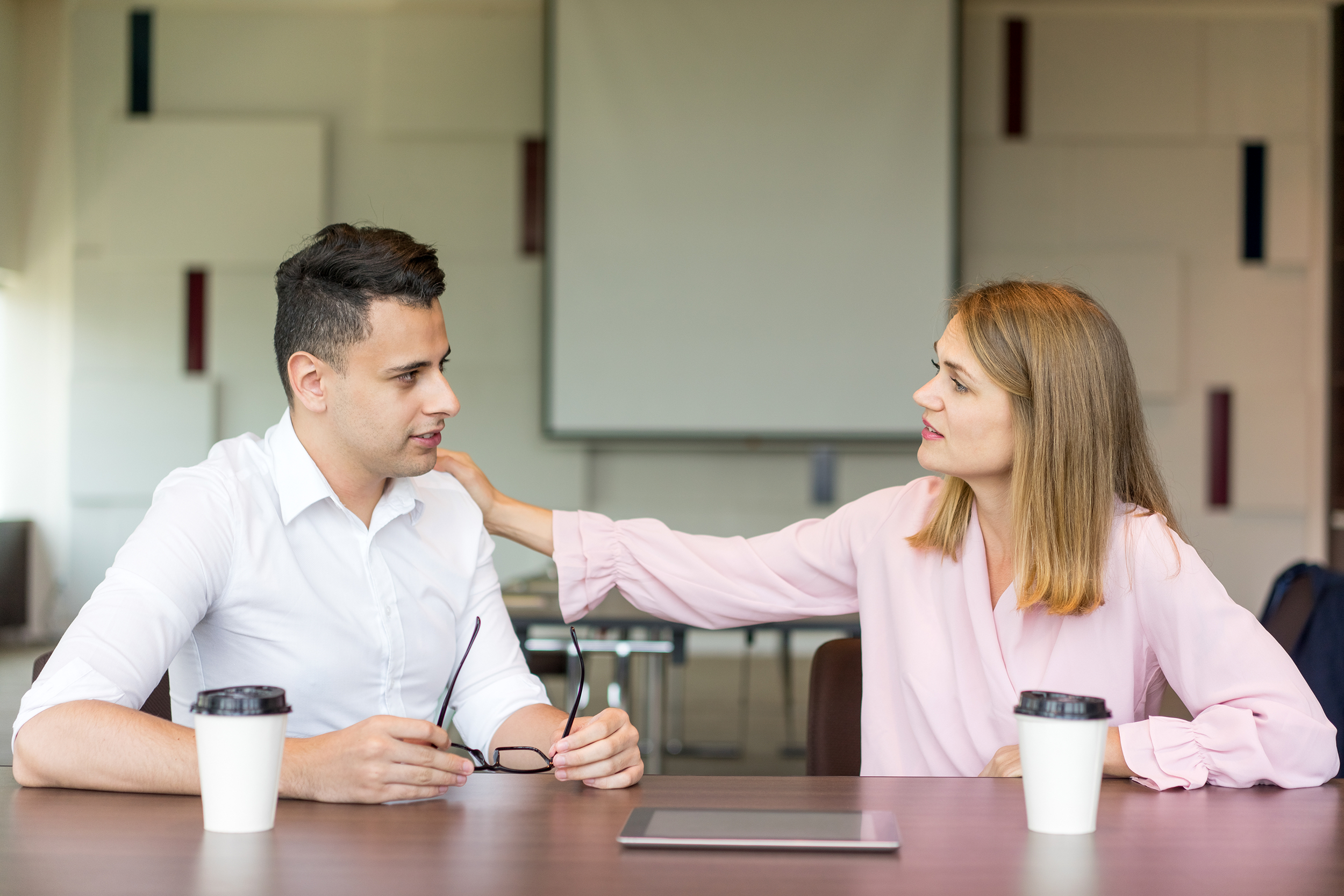 Boss consoling an employee