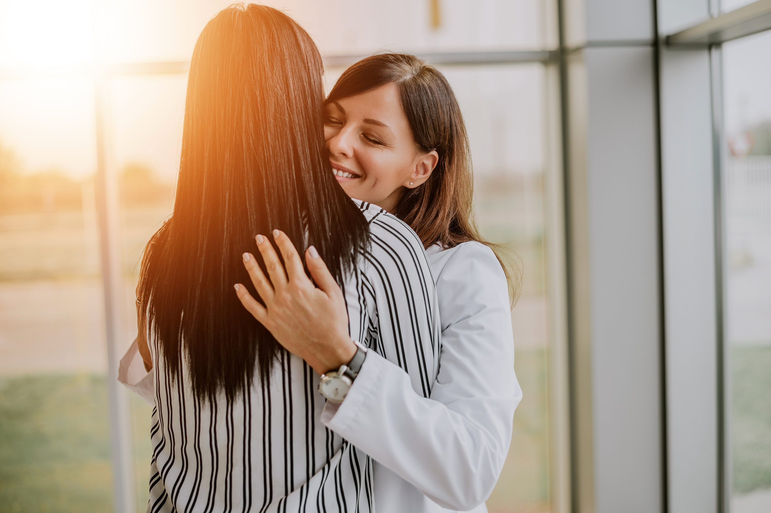 Employees hugging