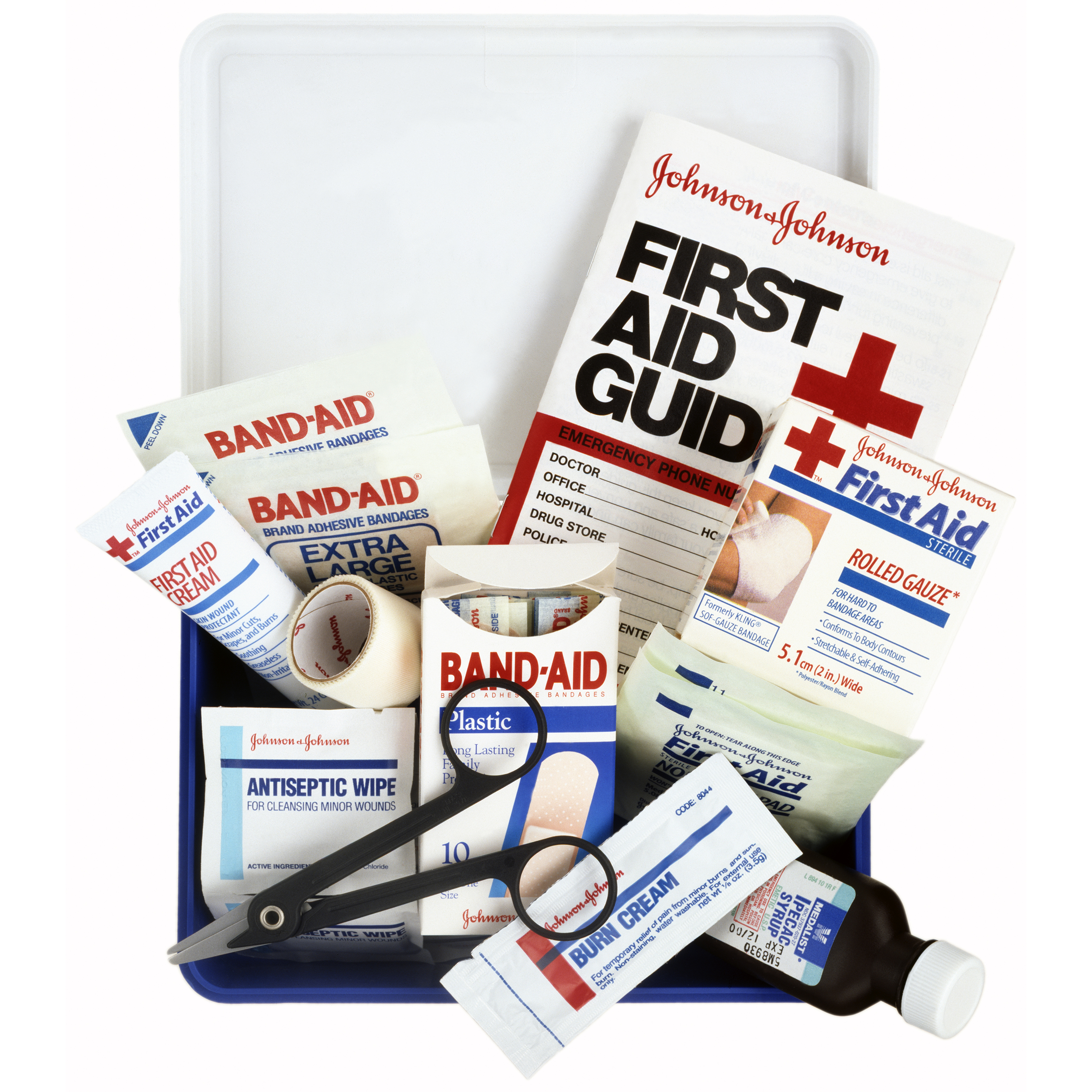 Opened first aid kit with bandages, cream, and more, on a white background