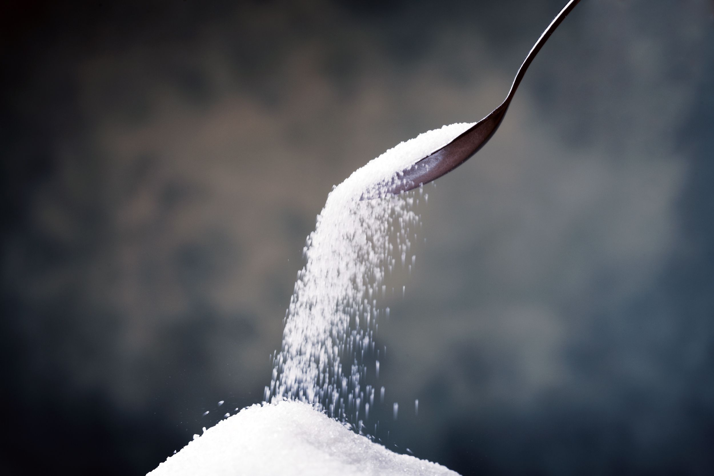 Spoon pouring sugar