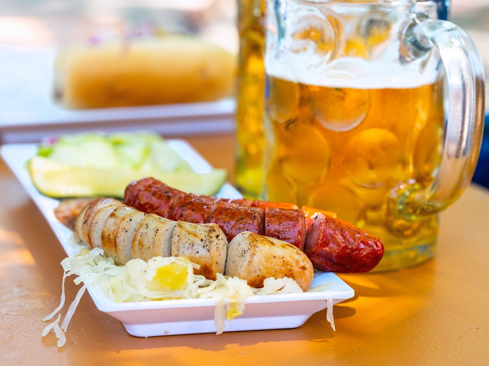 Gourmet German sausages, sauerkraut, and beer at a brewery patio