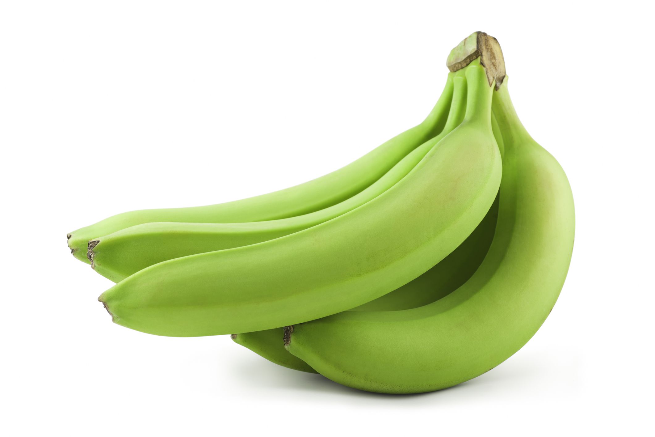 Green unripe bananas isolated on white. Includes clipping path.